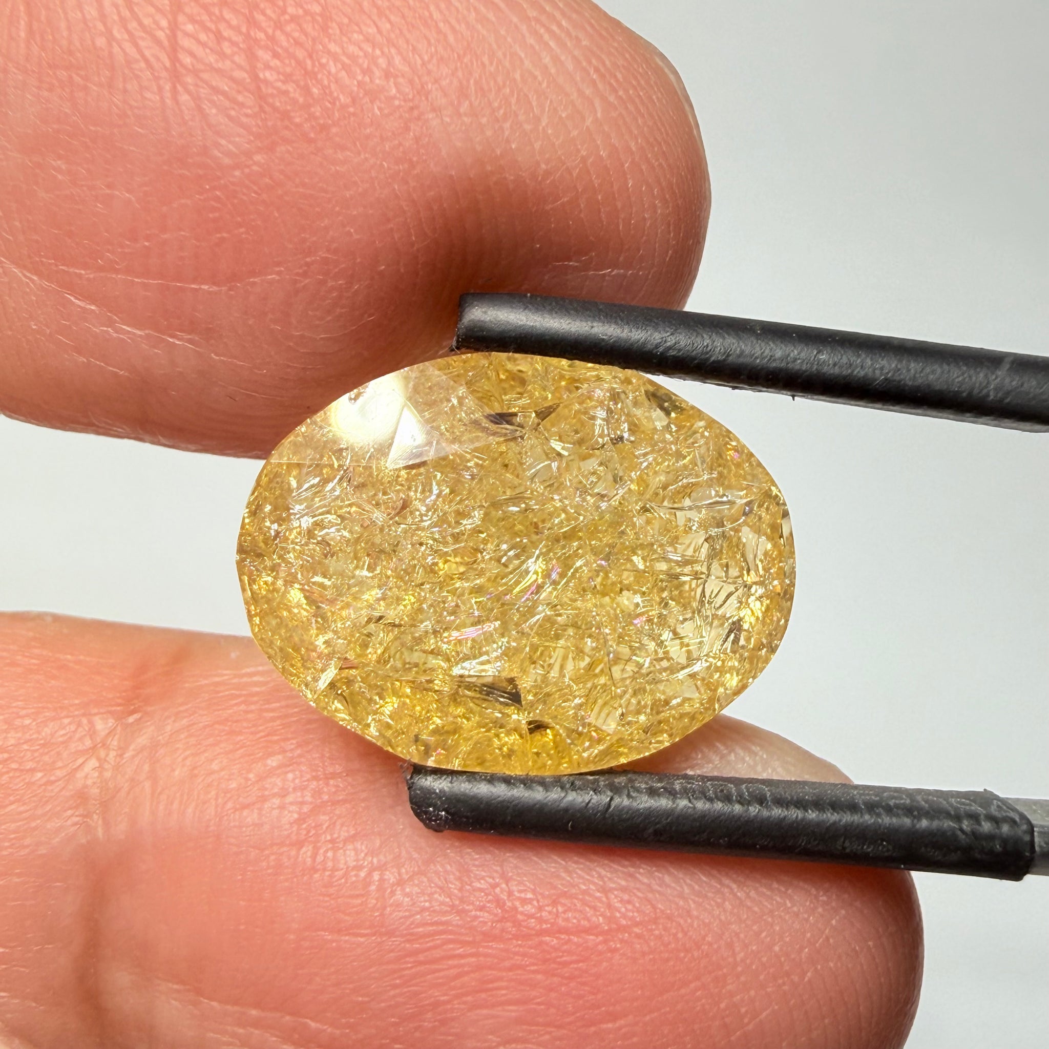 Ethiopian Opal that we cut 17 years ago and fractured internally, seems stable and none of the facets have broken, we thought it was quite pretty, from the initial Ethiopian Opal deposit, 6.87ct, Ethiopia, Untreated Unheated