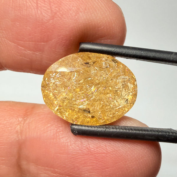 Ethiopian Opal that we cut 17 years ago and fractured internally, seems stable and none of the facets have broken, we thought it was quite pretty, from the initial Ethiopian Opal deposit, 6.87ct, Ethiopia, Untreated Unheated