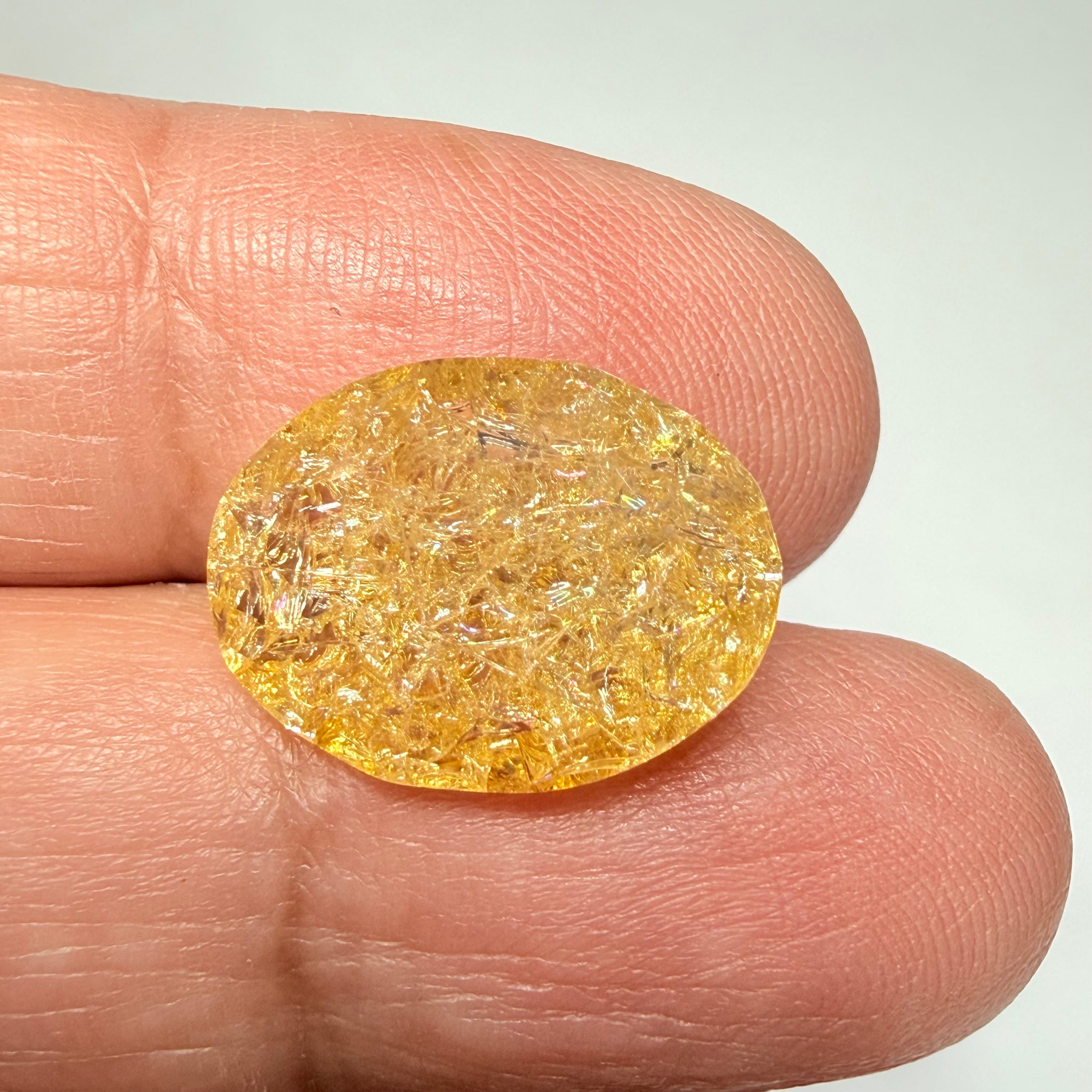 Ethiopian Opal that we cut 17 years ago and fractured internally, seems stable and none of the facets have broken, we thought it was quite pretty, from the initial Ethiopian Opal deposit, 6.87ct, Ethiopia, Untreated Unheated