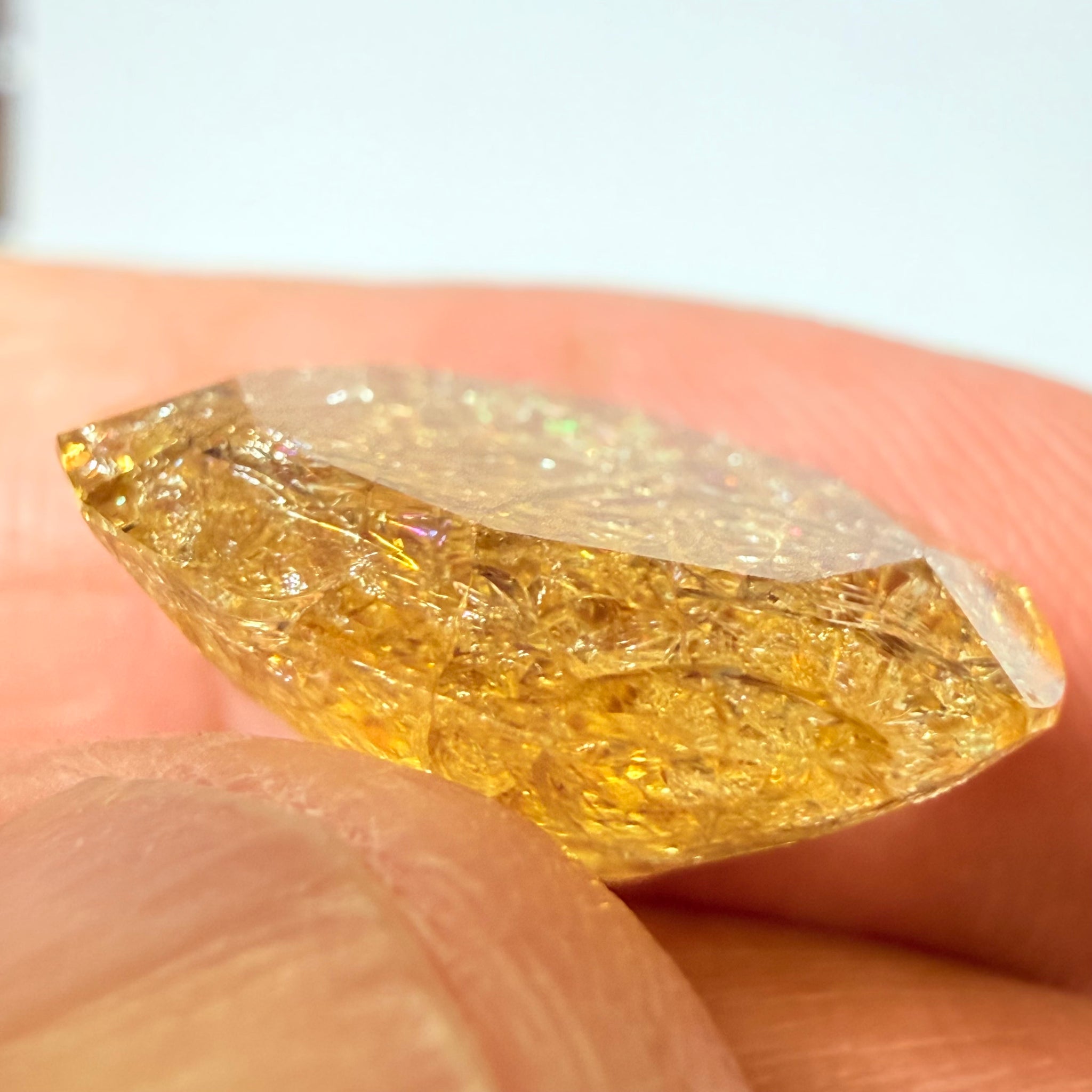 Ethiopian Opal that we cut 17 years ago and fractured internally, seems stable and none of the facets have broken, we thought it was quite pretty, from the initial Ethiopian Opal deposit, 6.87ct, Ethiopia, Untreated Unheated