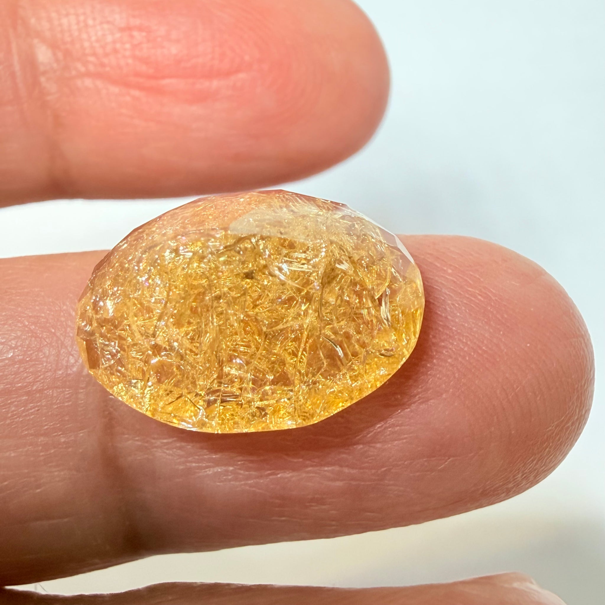 Ethiopian Opal that we cut 17 years ago and fractured internally, seems stable and none of the facets have broken, we thought it was quite pretty, from the initial Ethiopian Opal deposit, 6.87ct, Ethiopia, Untreated Unheated