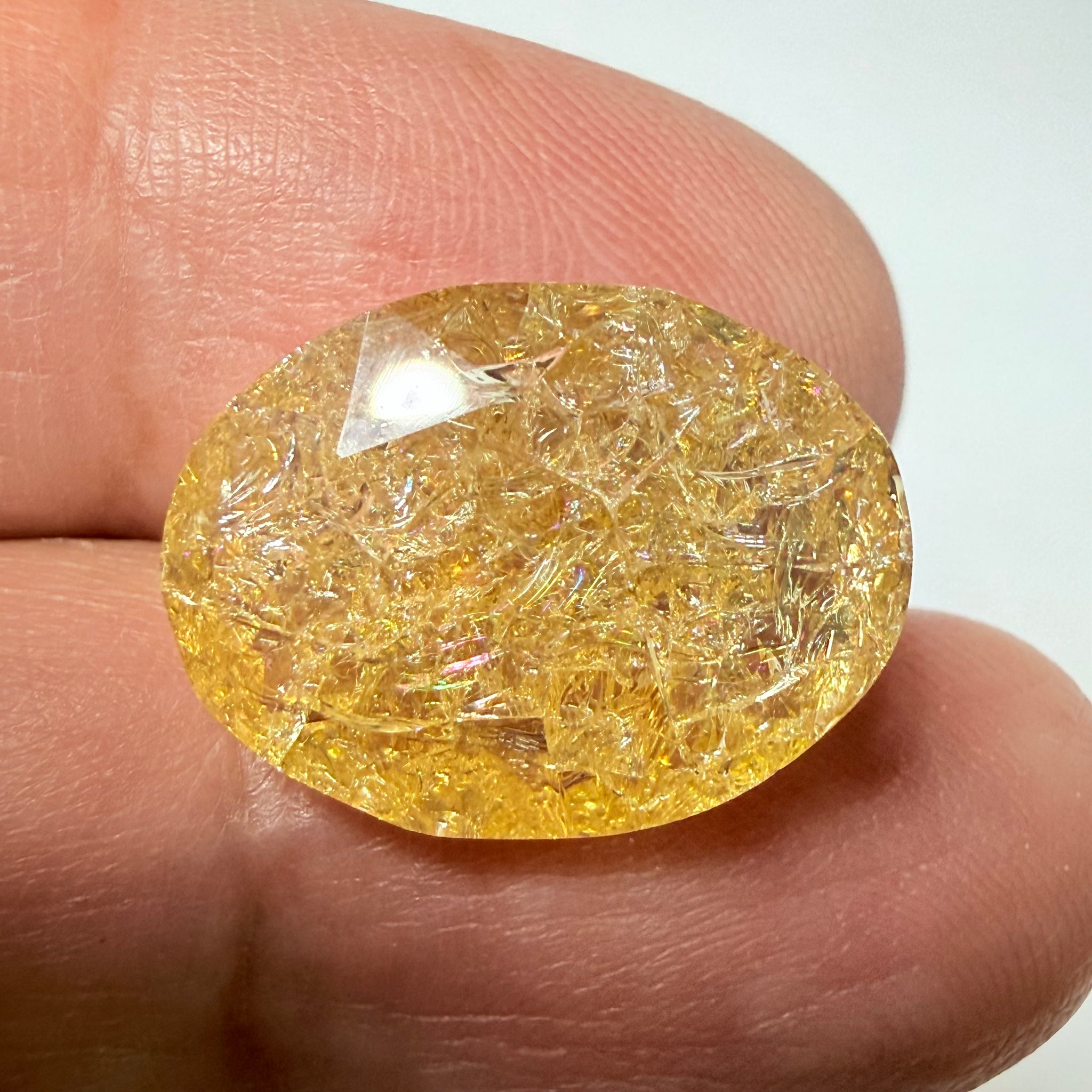 Ethiopian Opal that we cut 17 years ago and fractured internally, seems stable and none of the facets have broken, we thought it was quite pretty, from the initial Ethiopian Opal deposit, 6.87ct, Ethiopia, Untreated Unheated