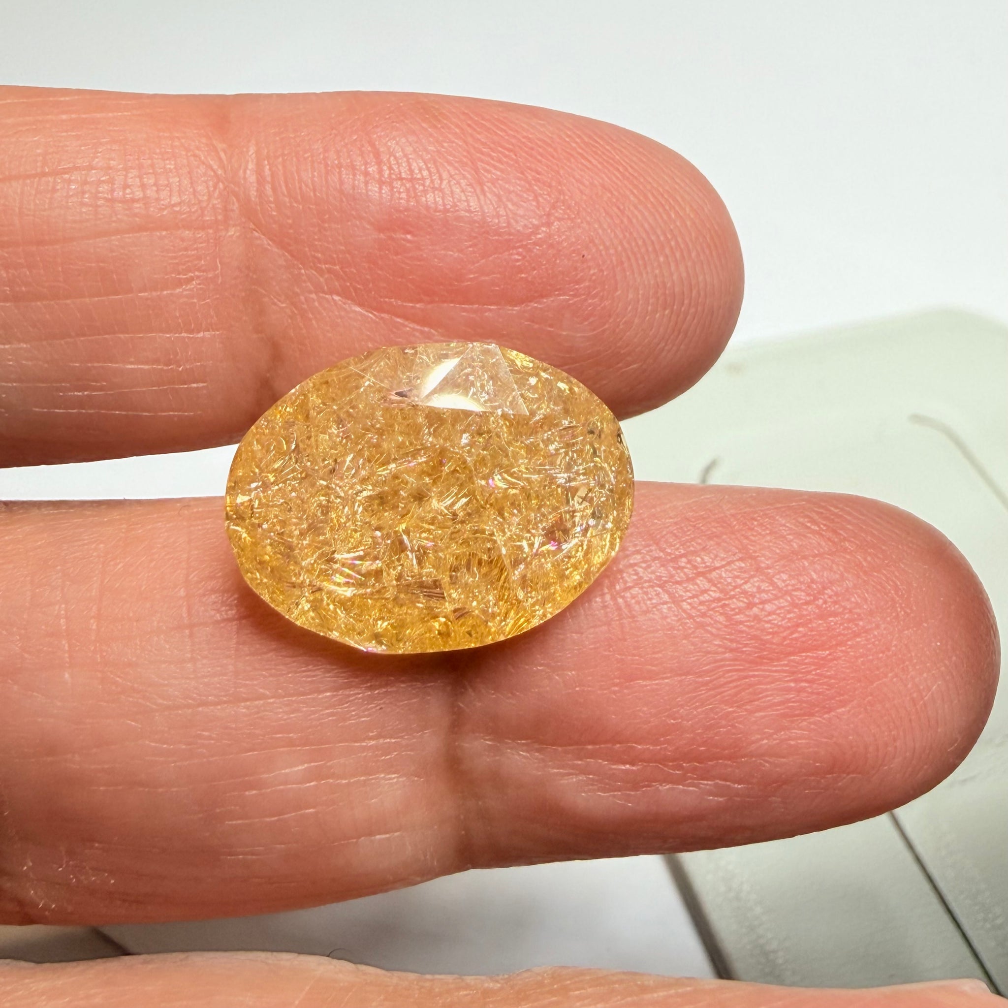 Ethiopian Opal that we cut 17 years ago and fractured internally, seems stable and none of the facets have broken, we thought it was quite pretty, from the initial Ethiopian Opal deposit, 6.87ct, Ethiopia, Untreated Unheated