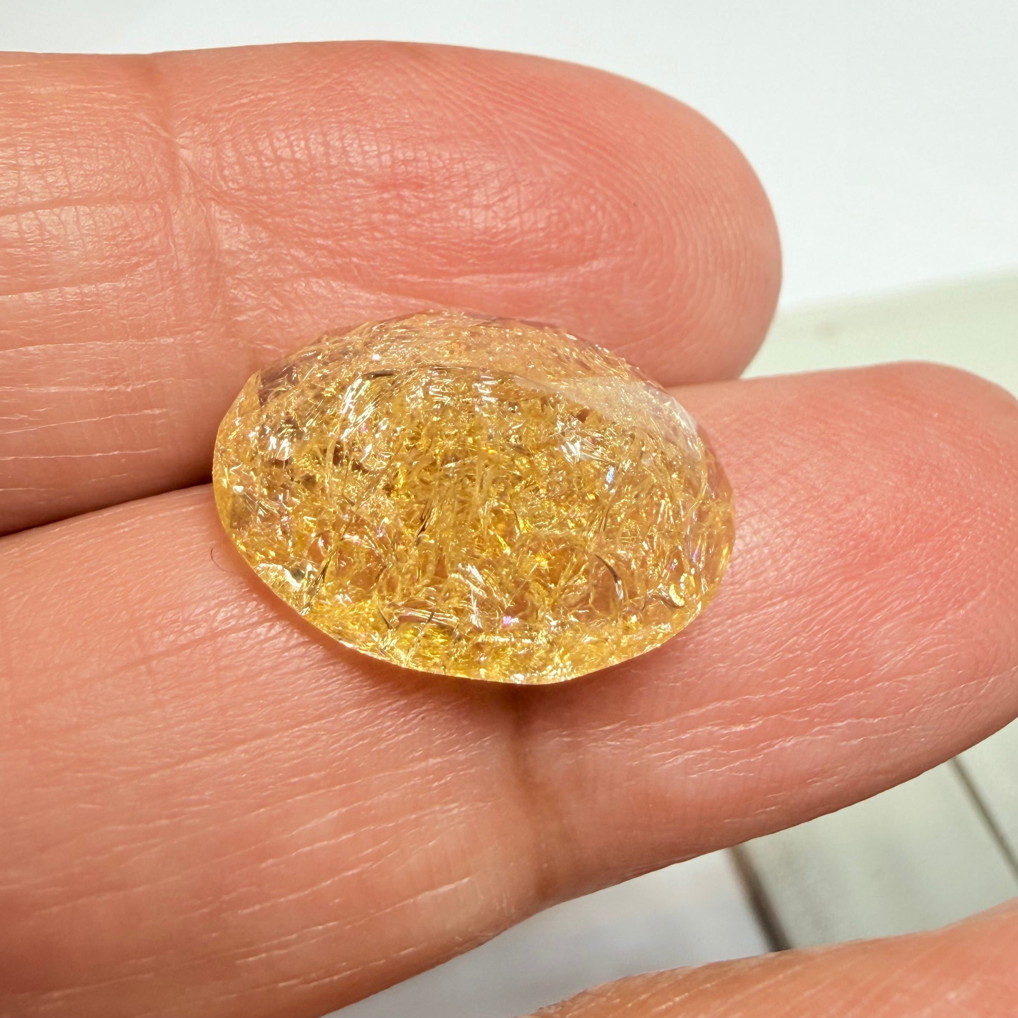 Ethiopian Opal that we cut 17 years ago and fractured internally, seems stable and none of the facets have broken, we thought it was quite pretty, from the initial Ethiopian Opal deposit, 6.87ct, Ethiopia, Untreated Unheated