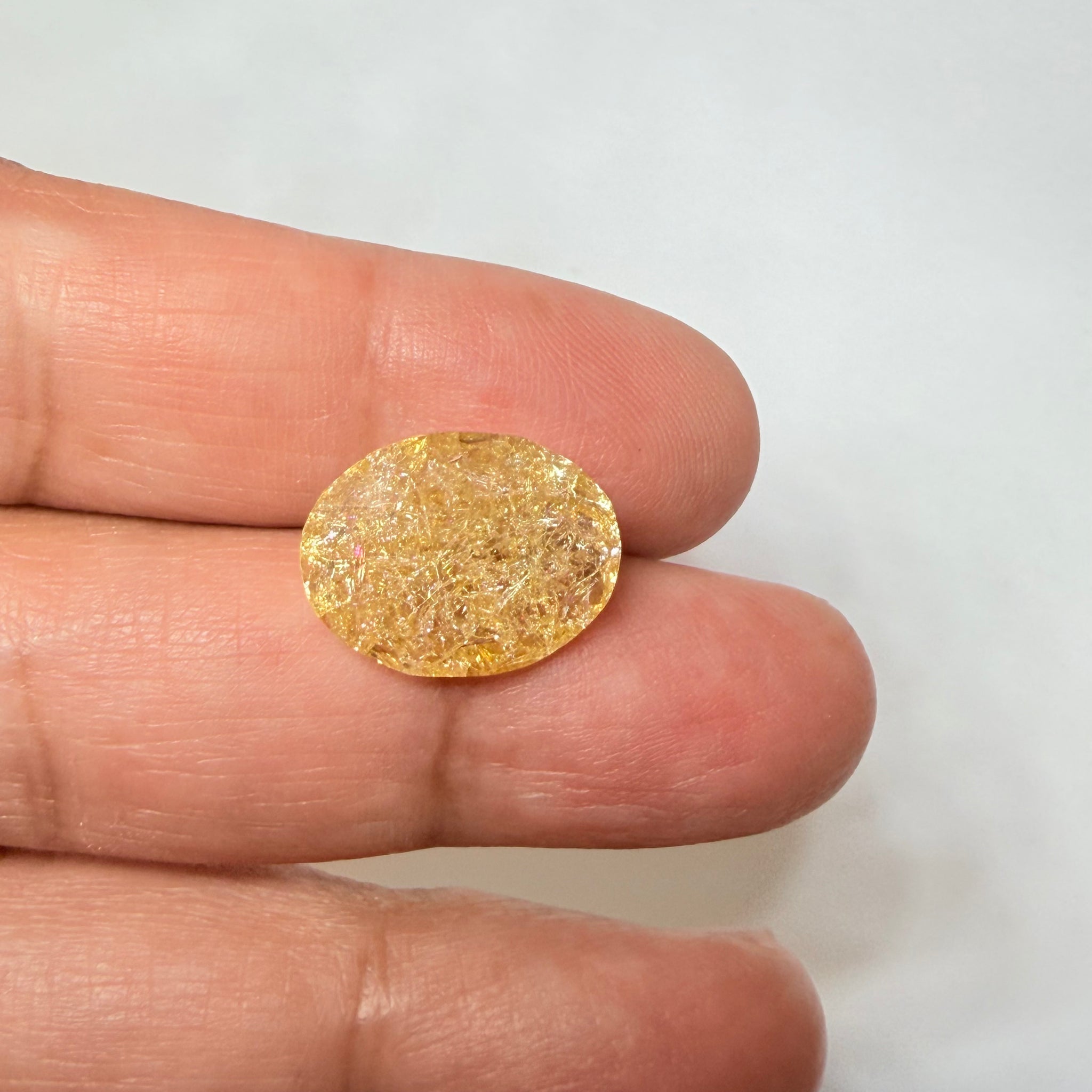 Ethiopian Opal that we cut 17 years ago and fractured internally, seems stable and none of the facets have broken, we thought it was quite pretty, from the initial Ethiopian Opal deposit, 6.87ct, Ethiopia, Untreated Unheated