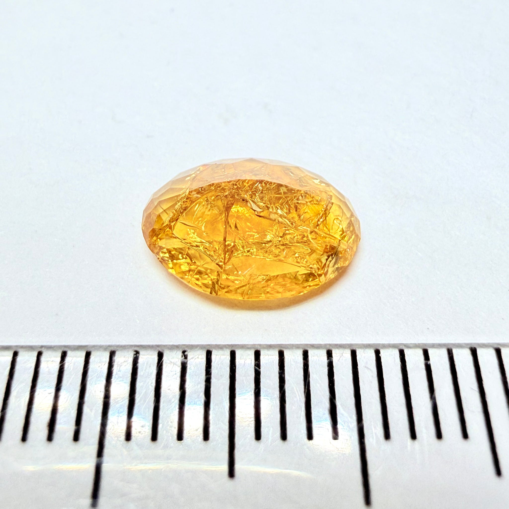 Ethiopian Opal that we cut 17 years ago and fractured internally, seems stable and none of the facets have broken, we thought it was quite pretty, from the initial Ethiopian Opal deposit, 1.43ct, Ethiopia, Untreated Unheated