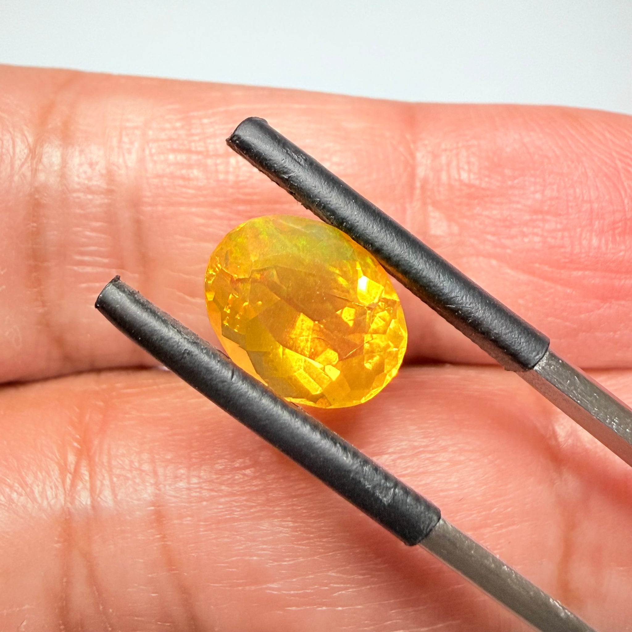 Ethiopian Opal that we cut 17 years ago and fractured internally, seems stable and none of the facets have broken, we thought it was quite pretty, from the initial Ethiopian Opal deposit, 2.00ct, Ethiopia, Untreated Unheated