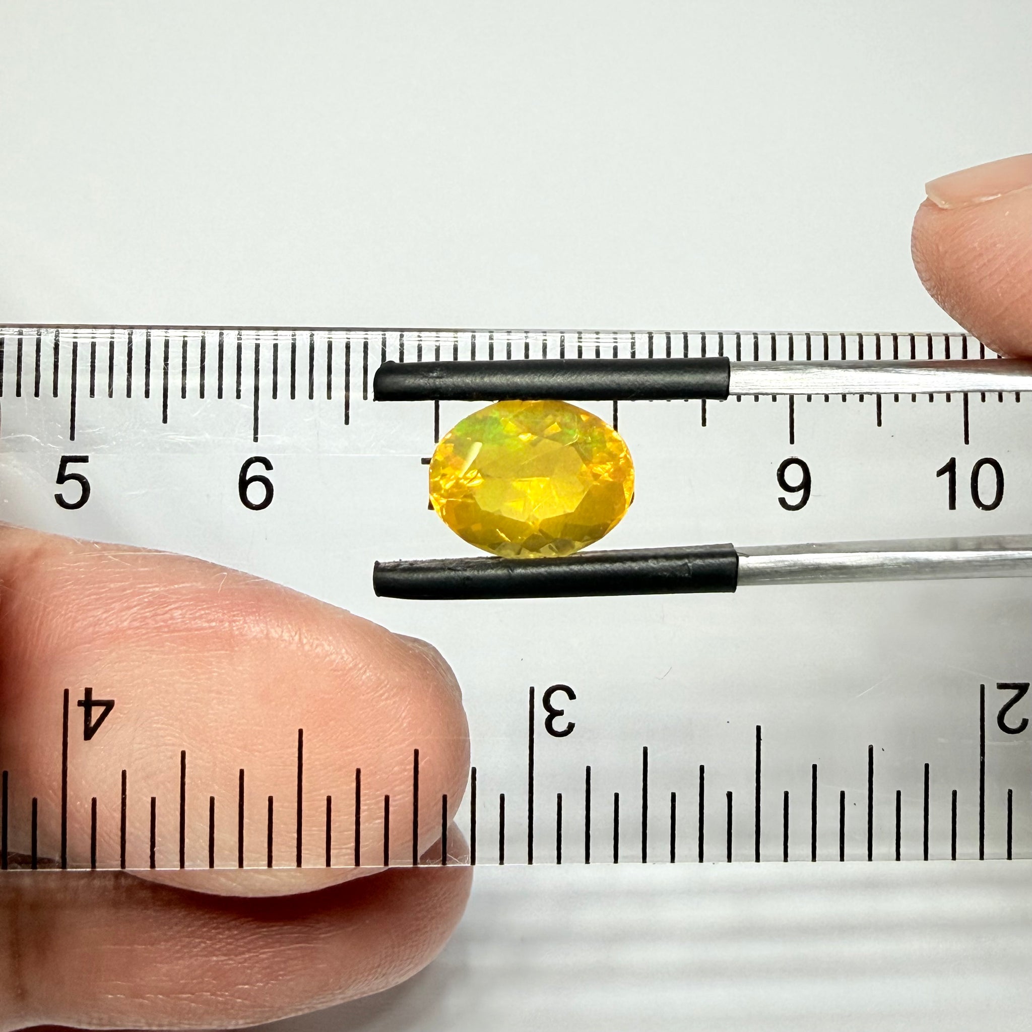 Ethiopian Opal that we cut 17 years ago and fractured internally, seems stable and none of the facets have broken, we thought it was quite pretty, from the initial Ethiopian Opal deposit, 2.00ct, Ethiopia, Untreated Unheated