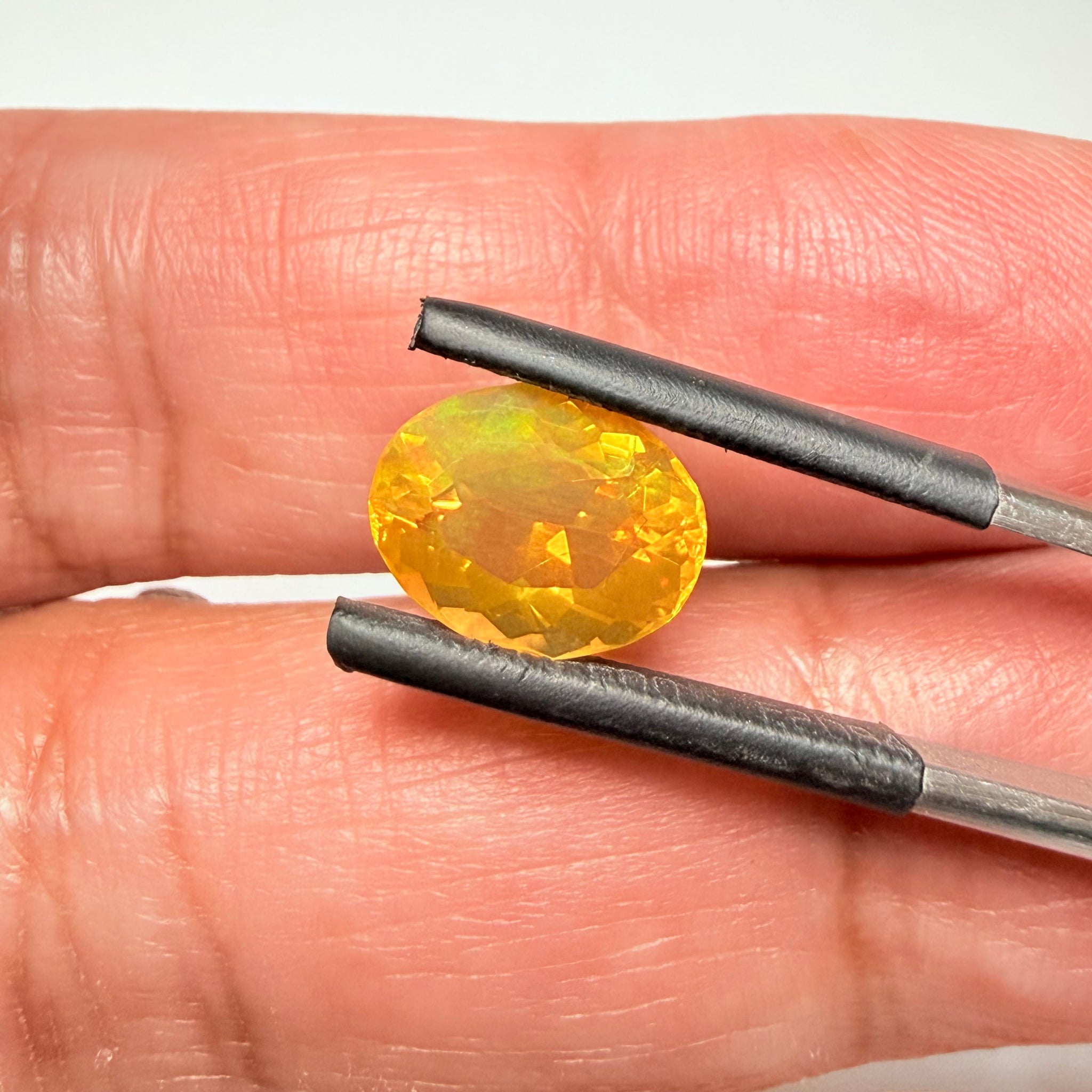 Ethiopian Opal that we cut 17 years ago and fractured internally, seems stable and none of the facets have broken, we thought it was quite pretty, from the initial Ethiopian Opal deposit, 2.00ct, Ethiopia, Untreated Unheated