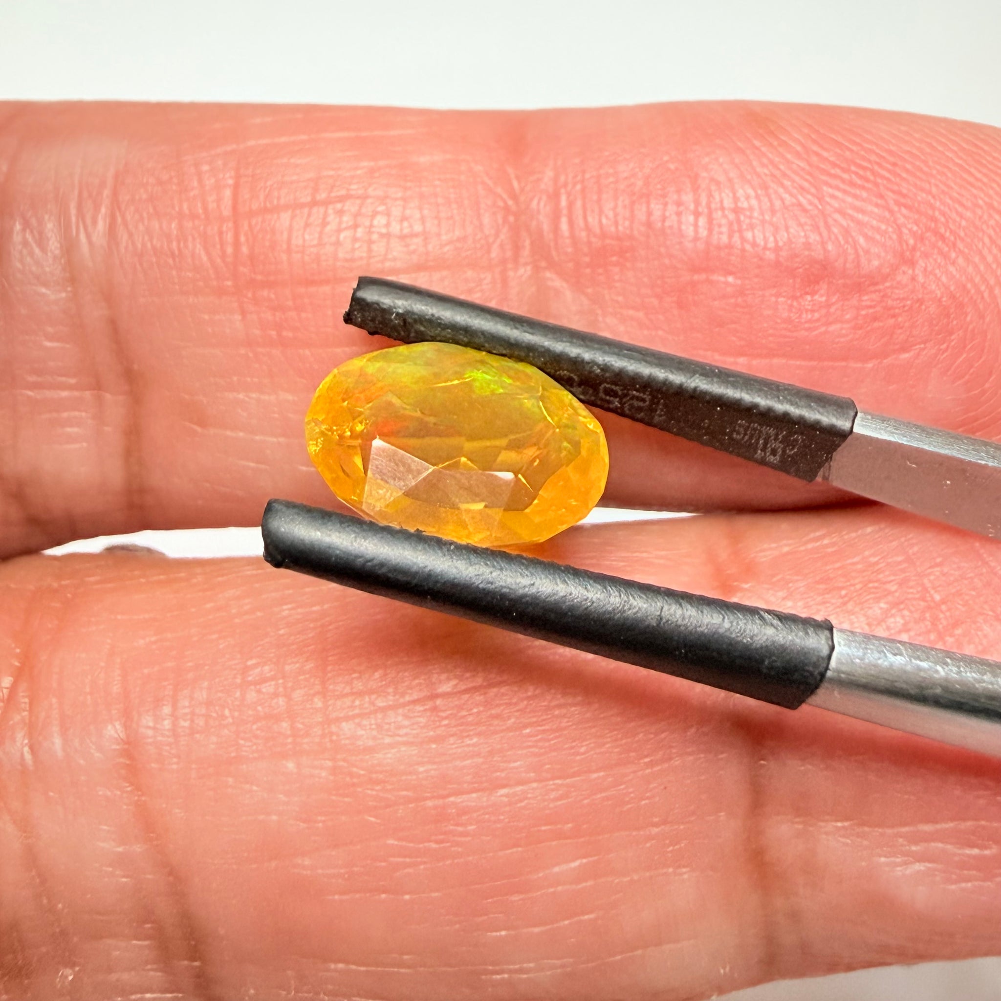 Ethiopian Opal that we cut 17 years ago and fractured internally, seems stable and none of the facets have broken, we thought it was quite pretty, from the initial Ethiopian Opal deposit, 2.00ct, Ethiopia, Untreated Unheated