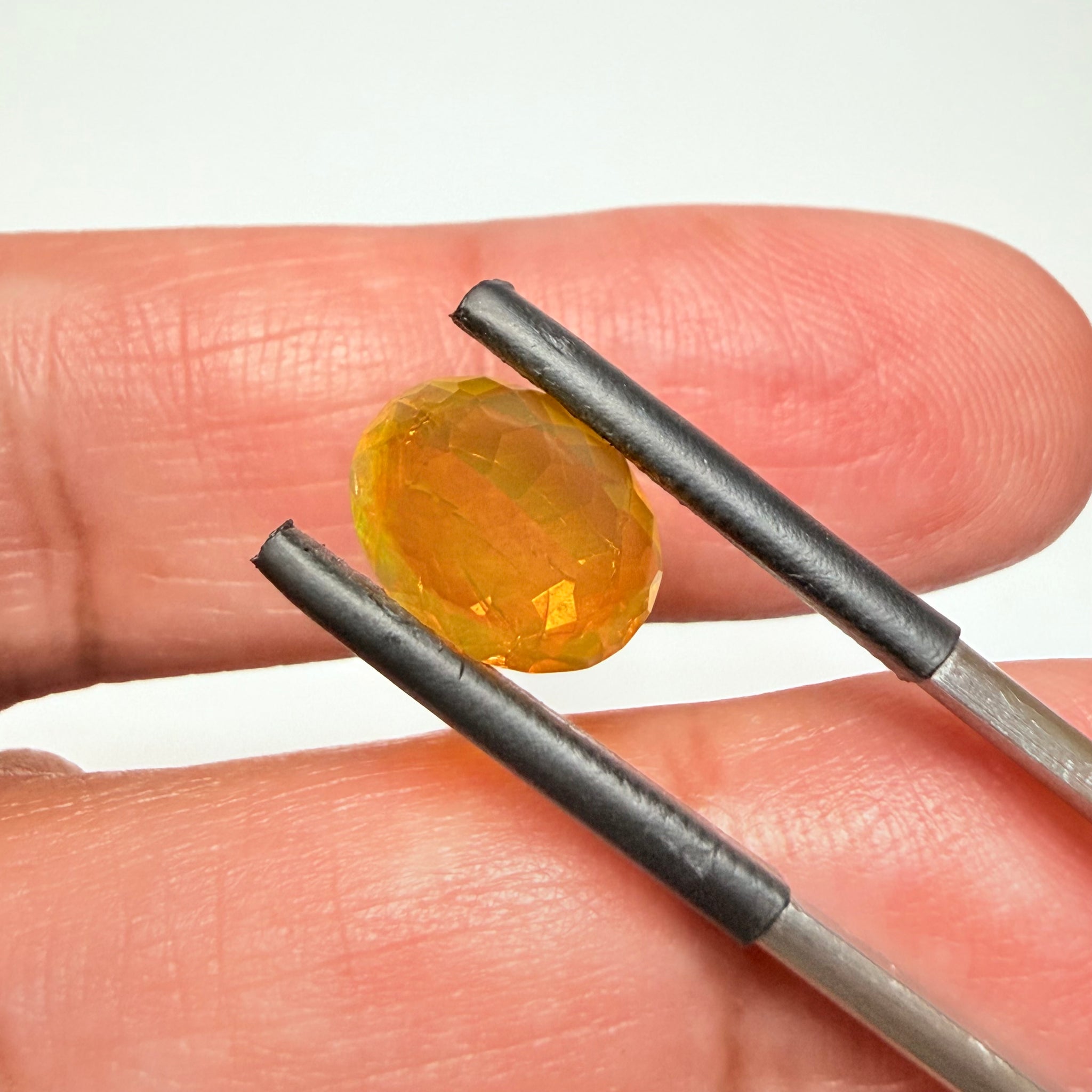 Ethiopian Opal that we cut 17 years ago and fractured internally, seems stable and none of the facets have broken, we thought it was quite pretty, from the initial Ethiopian Opal deposit, 2.00ct, Ethiopia, Untreated Unheated