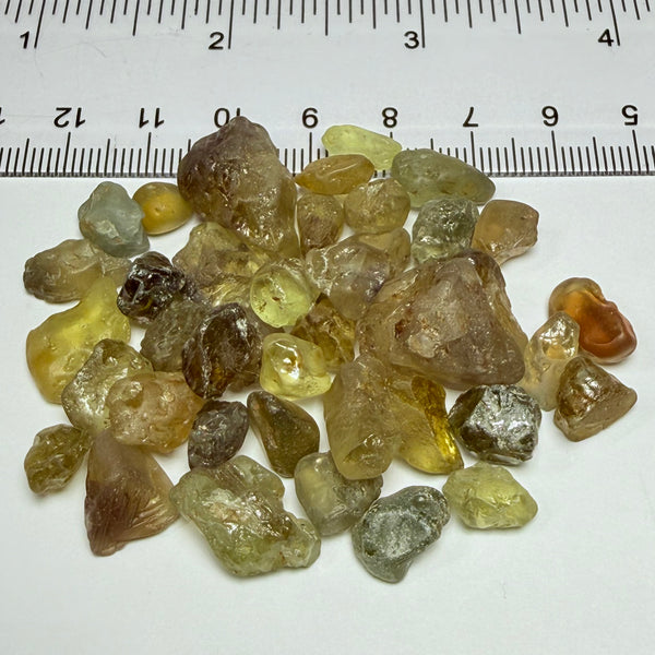 Chrysoberyl lot, 190.09ct, Tunduru, Tanzania, Untreated Unheated. A mix between faceting grade and cabbing grade rough, they change colour but only very very slightly, see video showing the different lights