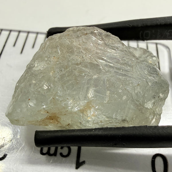 Umba Sapphire, 21.93ct, Umba, Tanzania, Untreated Unheated, flattish shape, moderate to heavy inclusions on the outside with a transparent needled, slightly included center, see the backlit photos