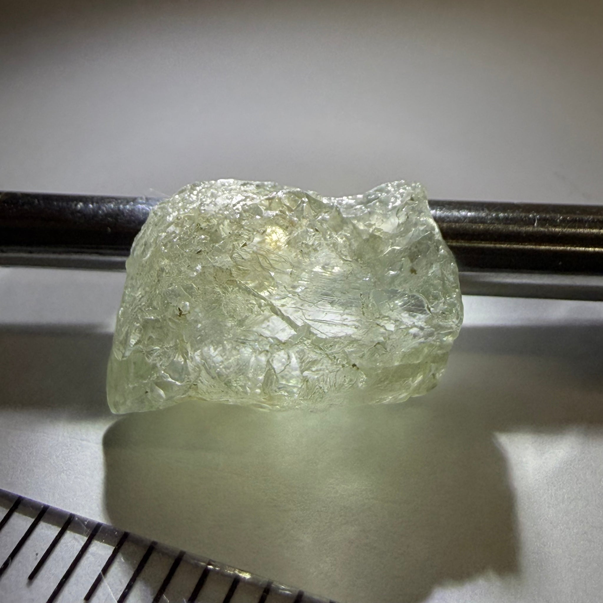 Umba Sapphire, 21.93ct, Umba, Tanzania, Untreated Unheated, flattish shape, moderate to heavy inclusions on the outside with a transparent needled, slightly included center, see the backlit photos