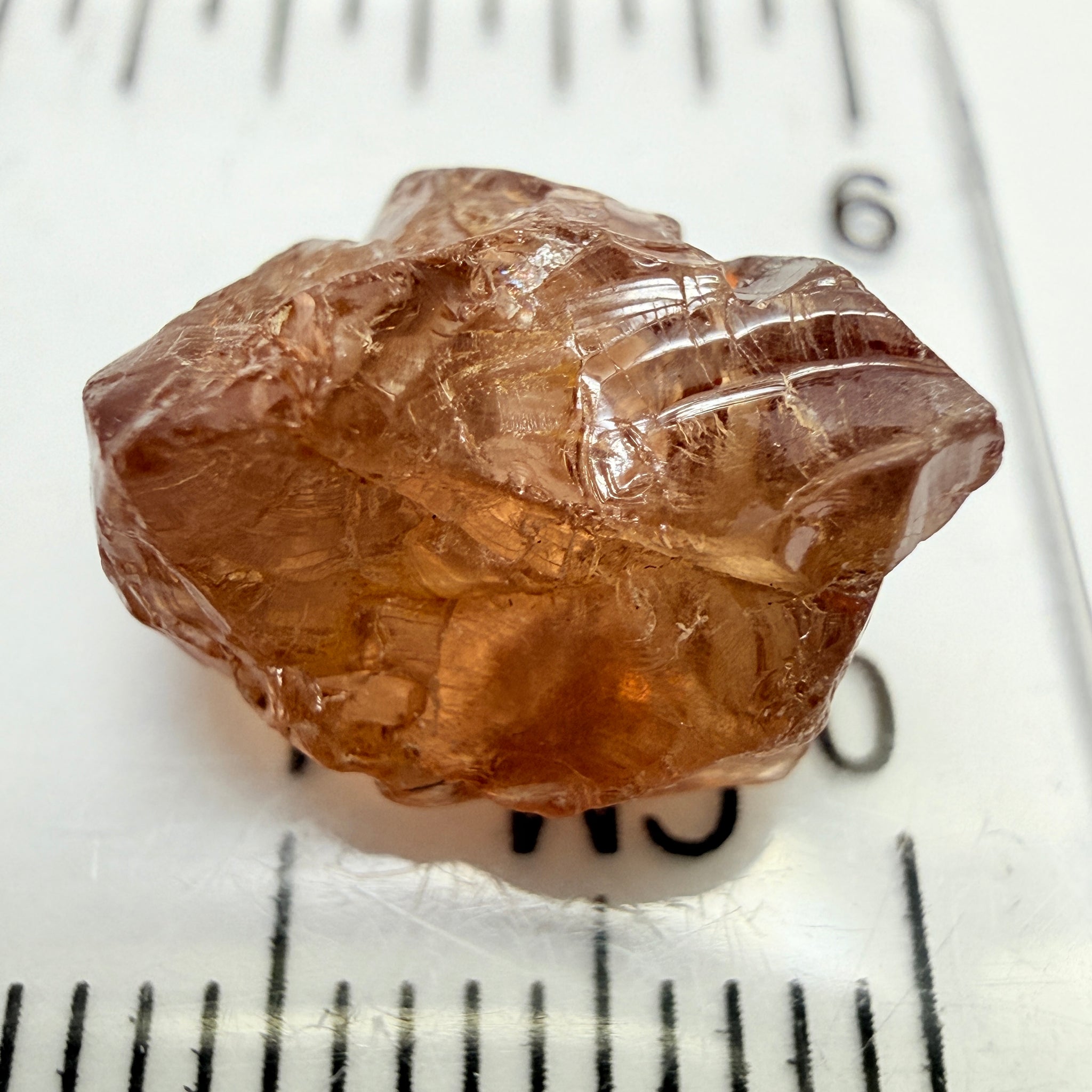 Peach Malaya Garnet, 8.21ct, silk and slight needles but no inclusions, Unheated Untreated, Umba Valley Tanzania, complicated shape.