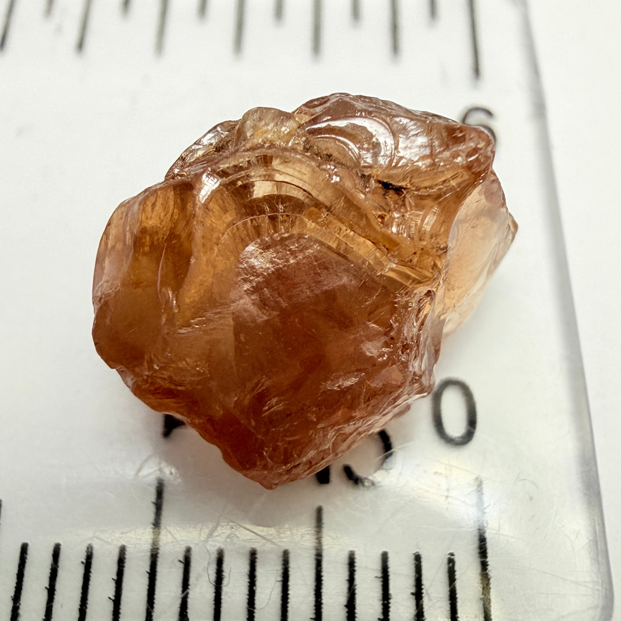 Peach Malaya Garnet, 8.21ct, silk and slight needles but no inclusions, Unheated Untreated, Umba Valley Tanzania, complicated shape.