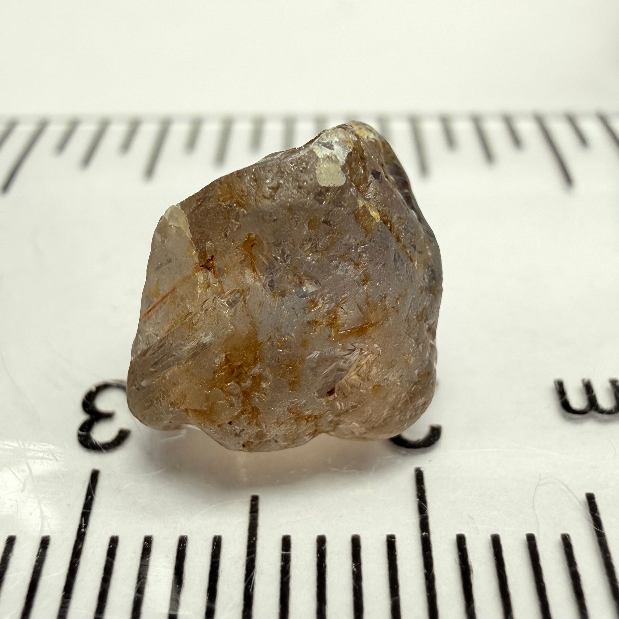 Umba Sapphire, 6.81ct, Umba, Tanzania, Untreated Unheated, fractures throughout the stone, cut as cab or facet with inclusions but there are quite a number