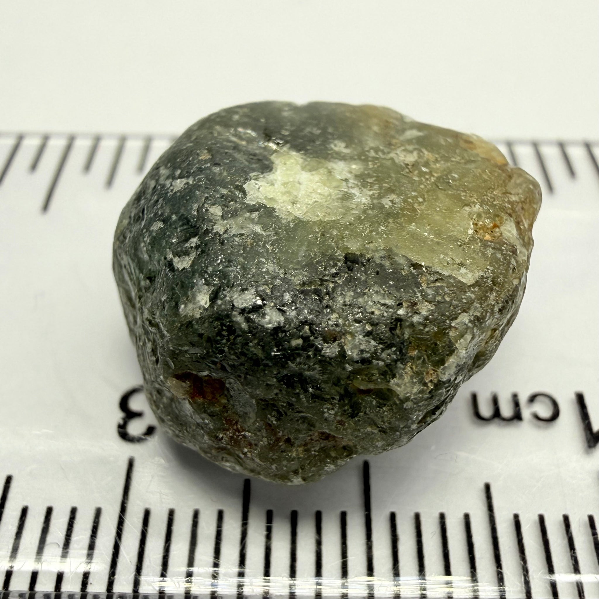 Umba Sapphire, 31.86ct, Umba, Tanzania, Untreated Unheated, low grade with a gemmy portion, you will have to grind though to get to it, portion is slightly to moderately included, see backlit photos