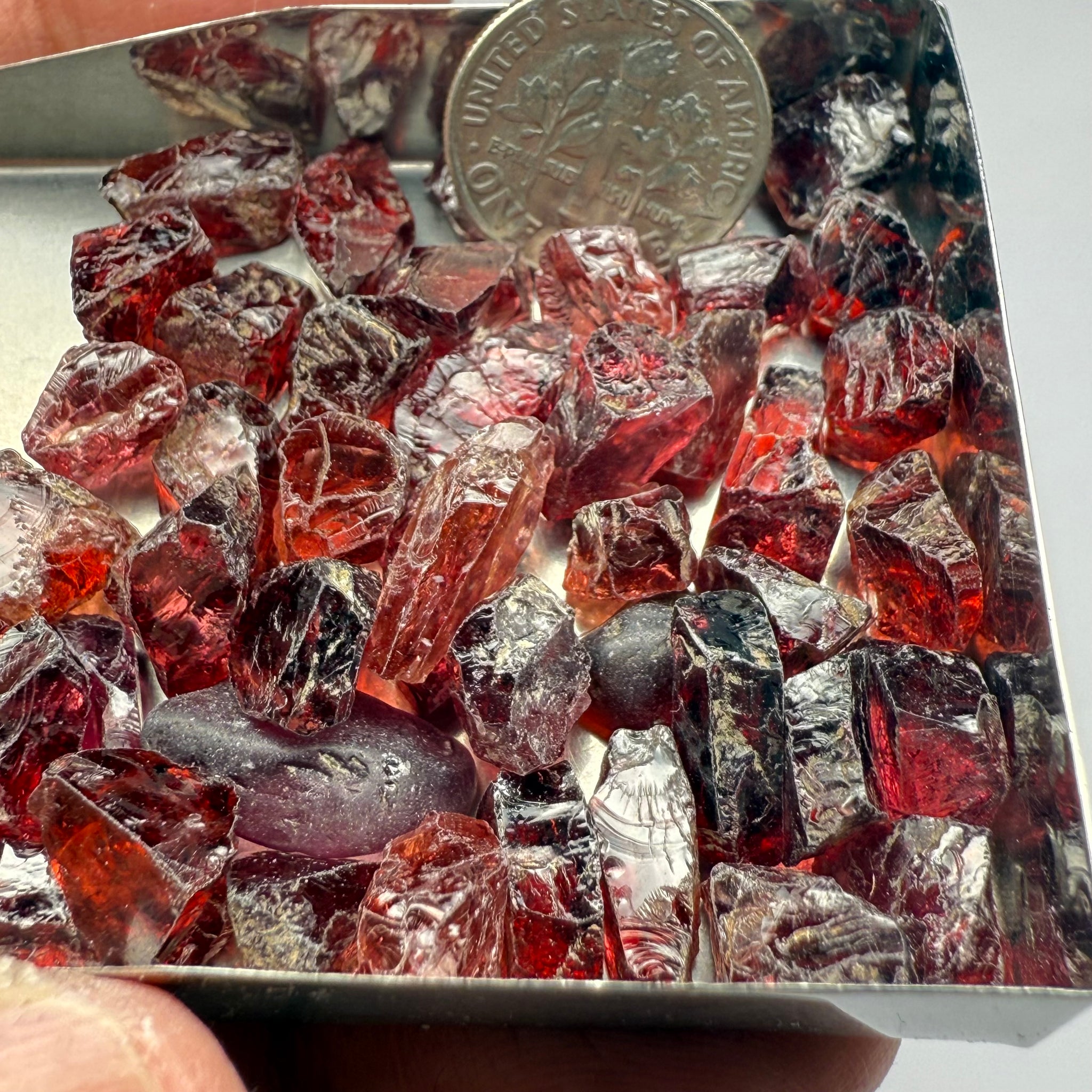 Umba Garnets, Umba Valley, Tanzania, Untreated Unheated. SINGLES price is per piece sold on a blind pour basis, FACETING ROUGH, EYE CLEAN TO SLIGHTLY UNDER EYE CLEAN, av. 3.70ct