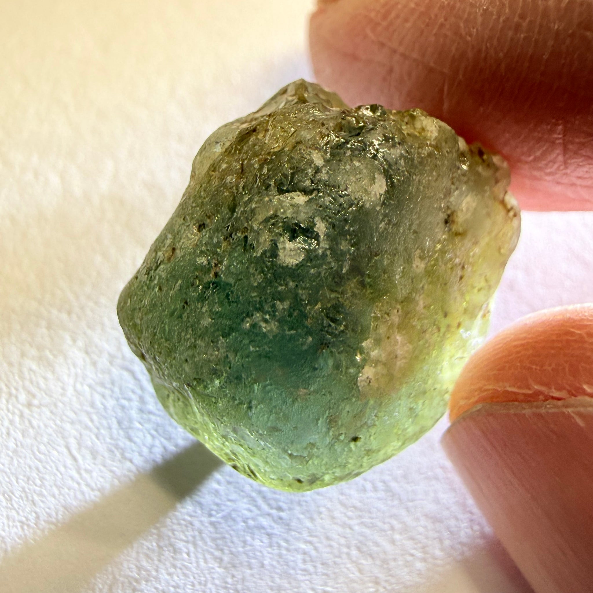 Umba Sapphire, 31.86ct, Umba, Tanzania, Untreated Unheated, low grade with a gemmy portion, you will have to grind though to get to it, portion is slightly to moderately included, see backlit photos