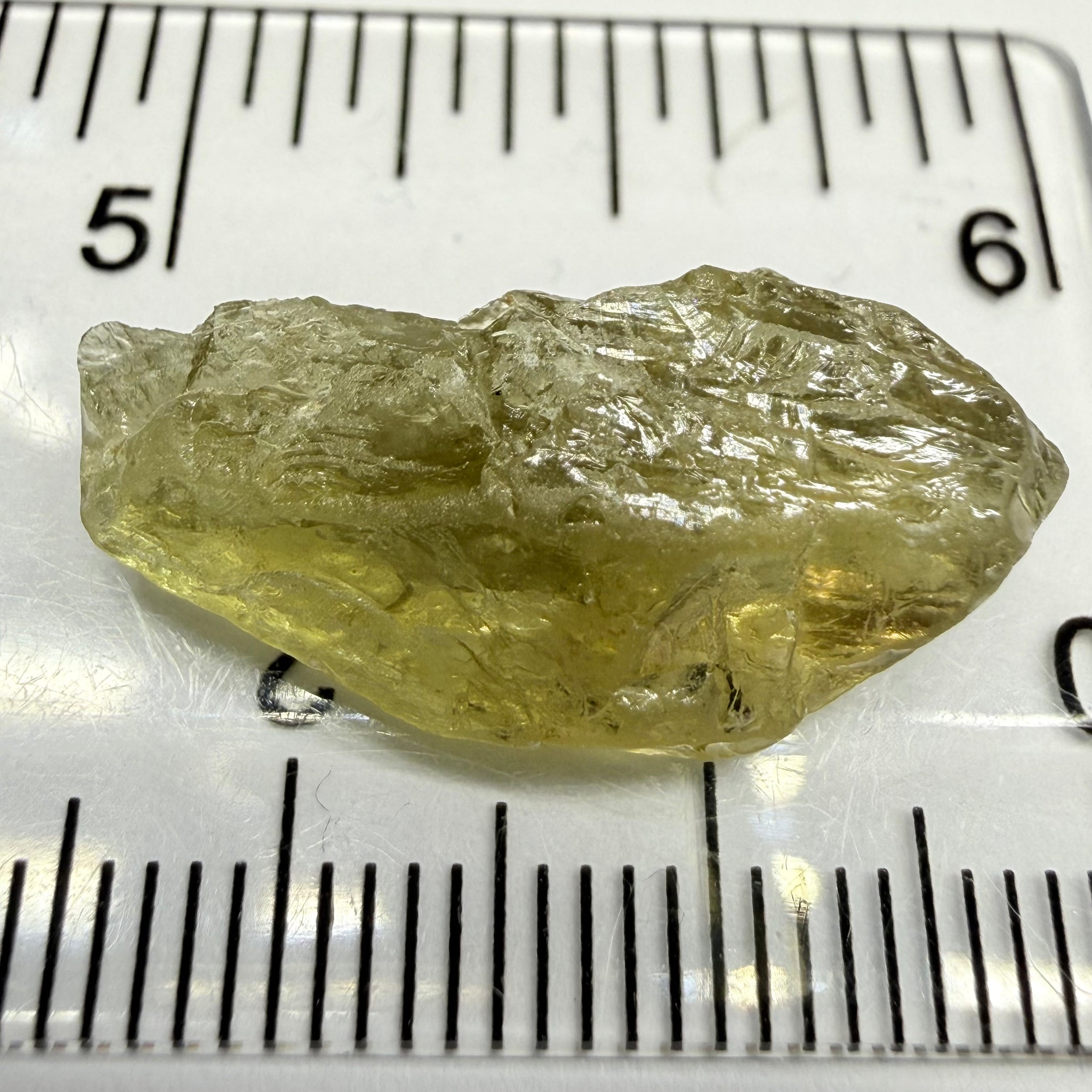 Umba Yellow Sapphire, 13.76ct, Umba, Tanzania, Untreated Unheated, flat stone, there is a fracture at the end, I’ve marked it in one picture, rest is slightly included
