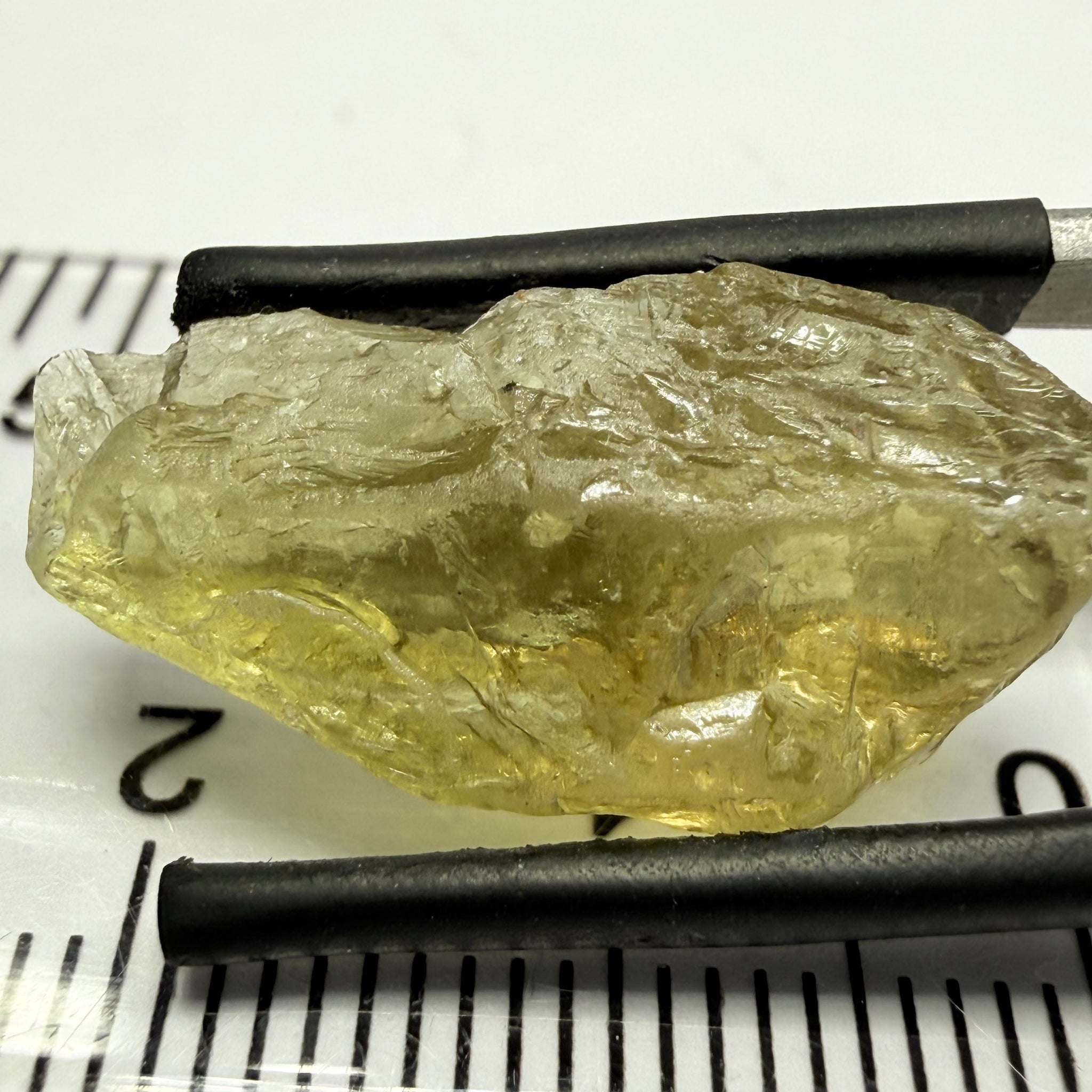 Umba Yellow Sapphire, 13.76ct, Umba, Tanzania, Untreated Unheated, flat stone, there is a fracture at the end, I’ve marked it in one picture, rest is slightly included