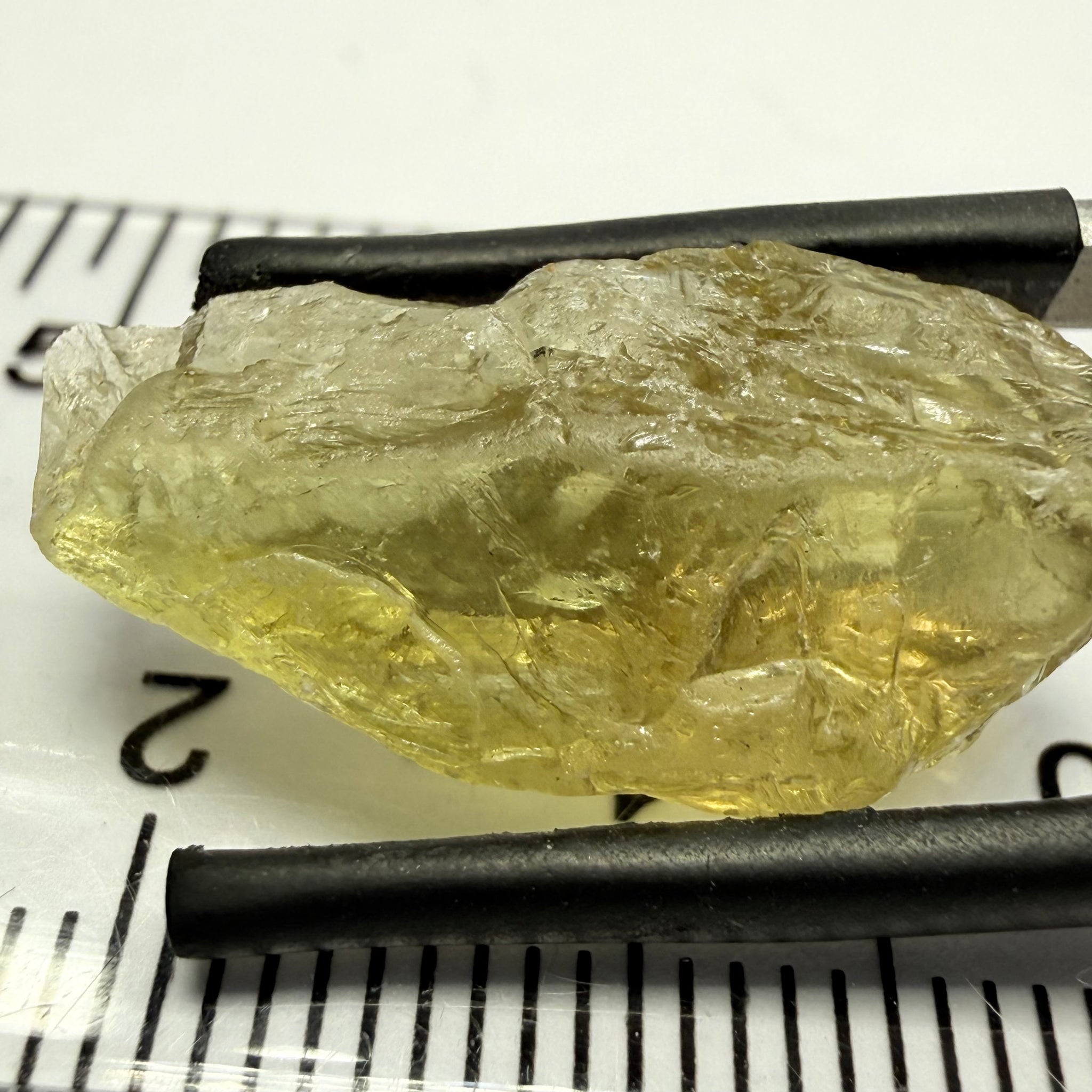 Umba Yellow Sapphire, 13.76ct, Umba, Tanzania, Untreated Unheated, flat stone, there is a fracture at the end, I’ve marked it in one picture, rest is slightly included