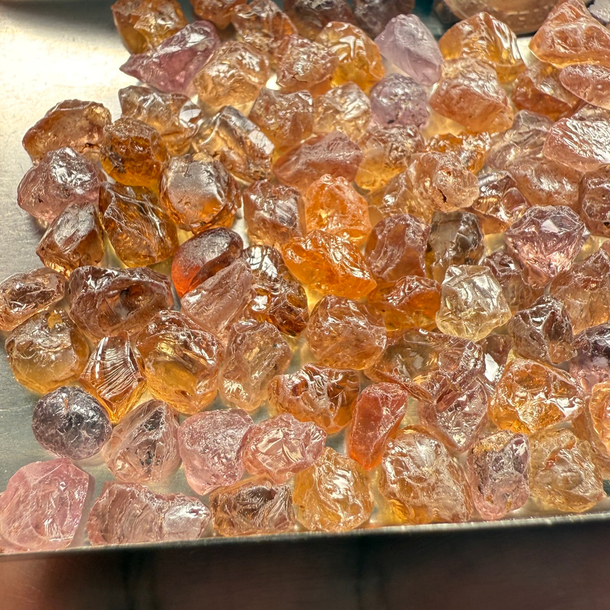 Garnet MIX, look closely it’s a whole mix of Mandarins, Colour Changers, Lindi, Mahenge Garnets and more all mixed up, see closeup, Tanzania, Untreated Unheated. SINGLES price is per piece sold on a blind pour basis, some clean some included, av. 1.4ct