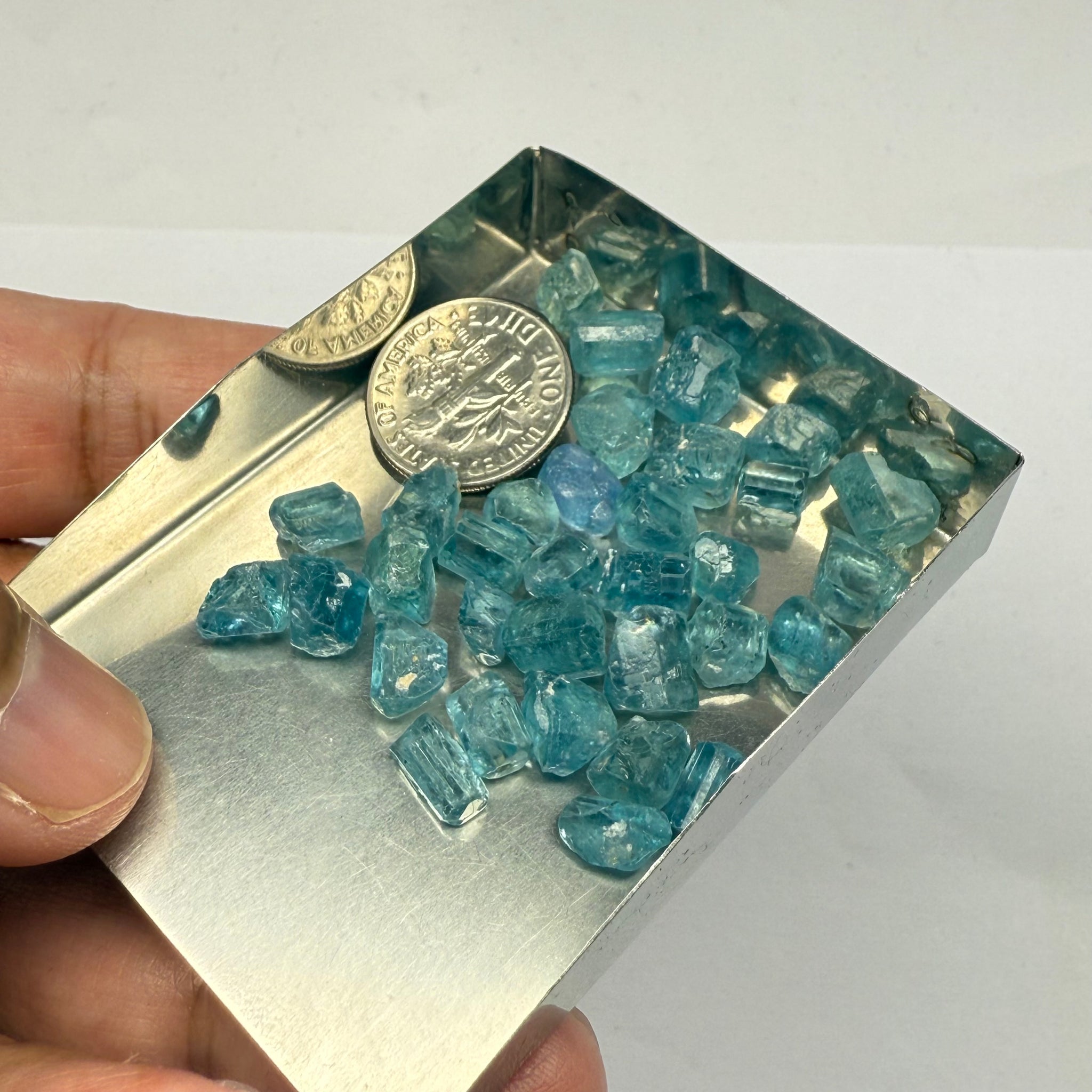 Blue Apatite Crystals from Merelani, Tanzania, Untreated Unheated. SINGLES price is per piece sold on a blind pour basis, av. 1.45ct