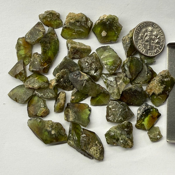Gemmy Vanadium Sphene Crystals from Mondo (same mine as mondo quartz), Tanzania, Untreated Unheated. SINGLES price is per piece sold on a blind pour basis, specimen grade, you could facet them but they are classic Sphene “wedge” shapes
