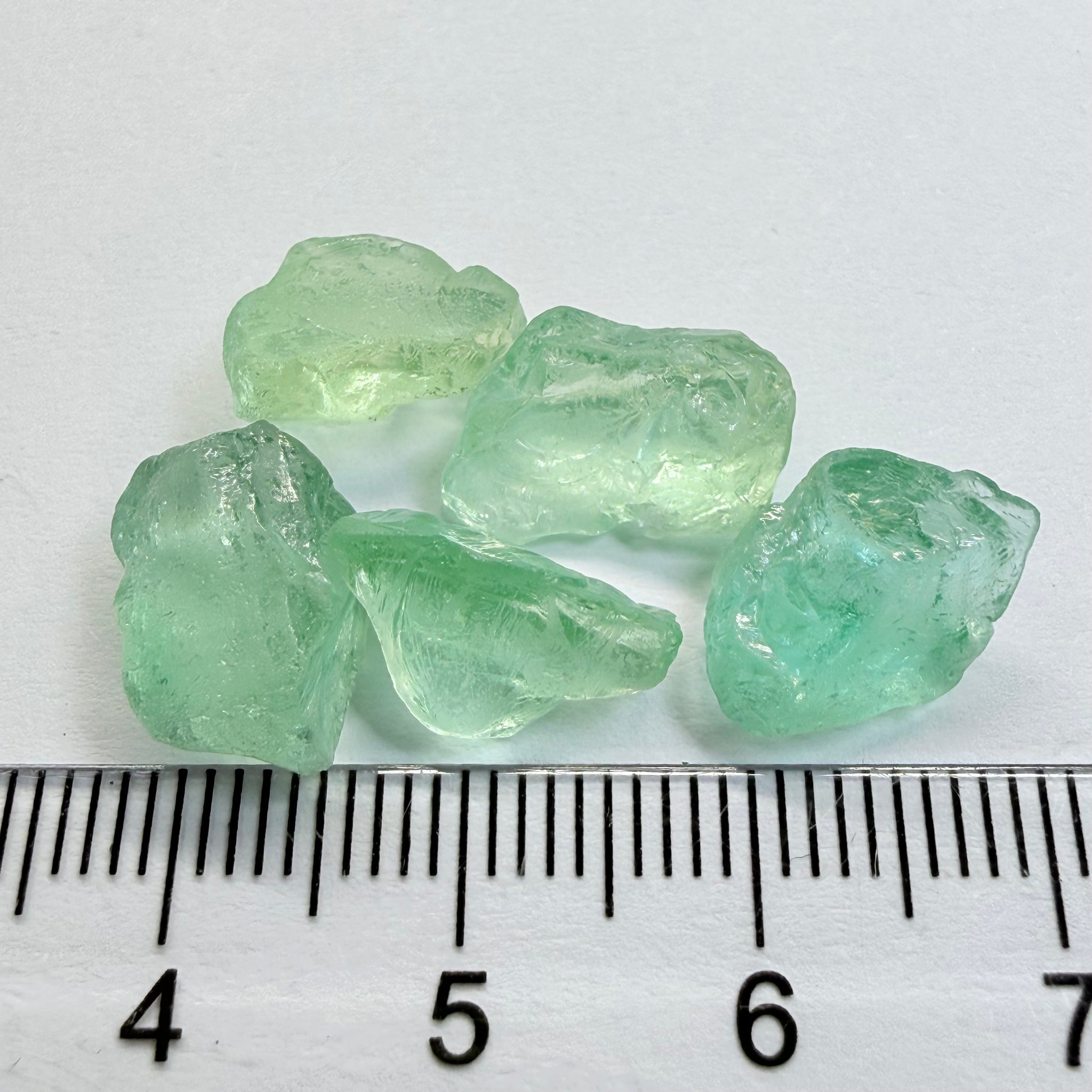 Aquamarine Lot, 22.31ct, Loliondo, Tanzania, Untreated Unheated, vs-vvs, one has a flat shape