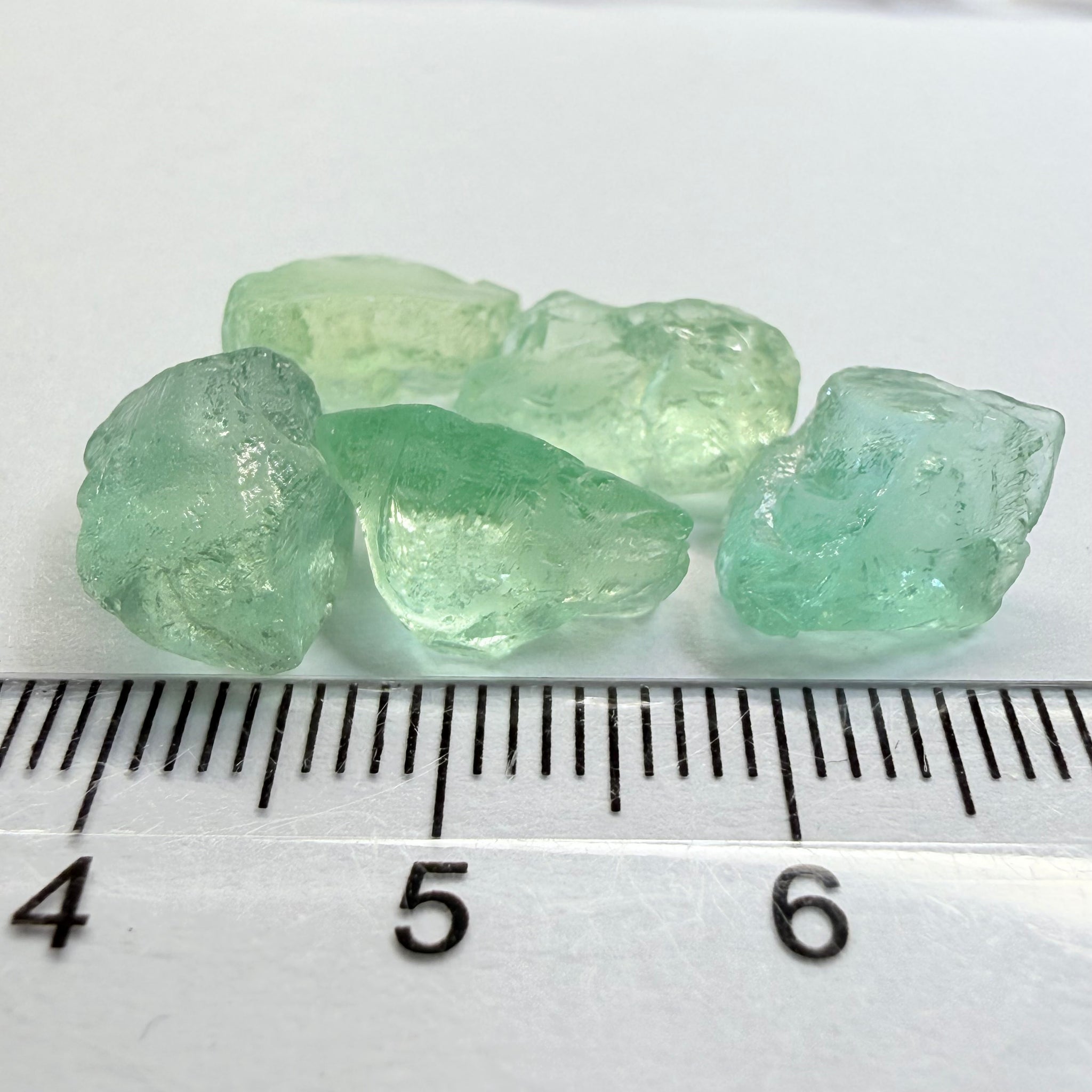 Aquamarine Lot, 22.31ct, Loliondo, Tanzania, Untreated Unheated, vs-vvs, one has a flat shape