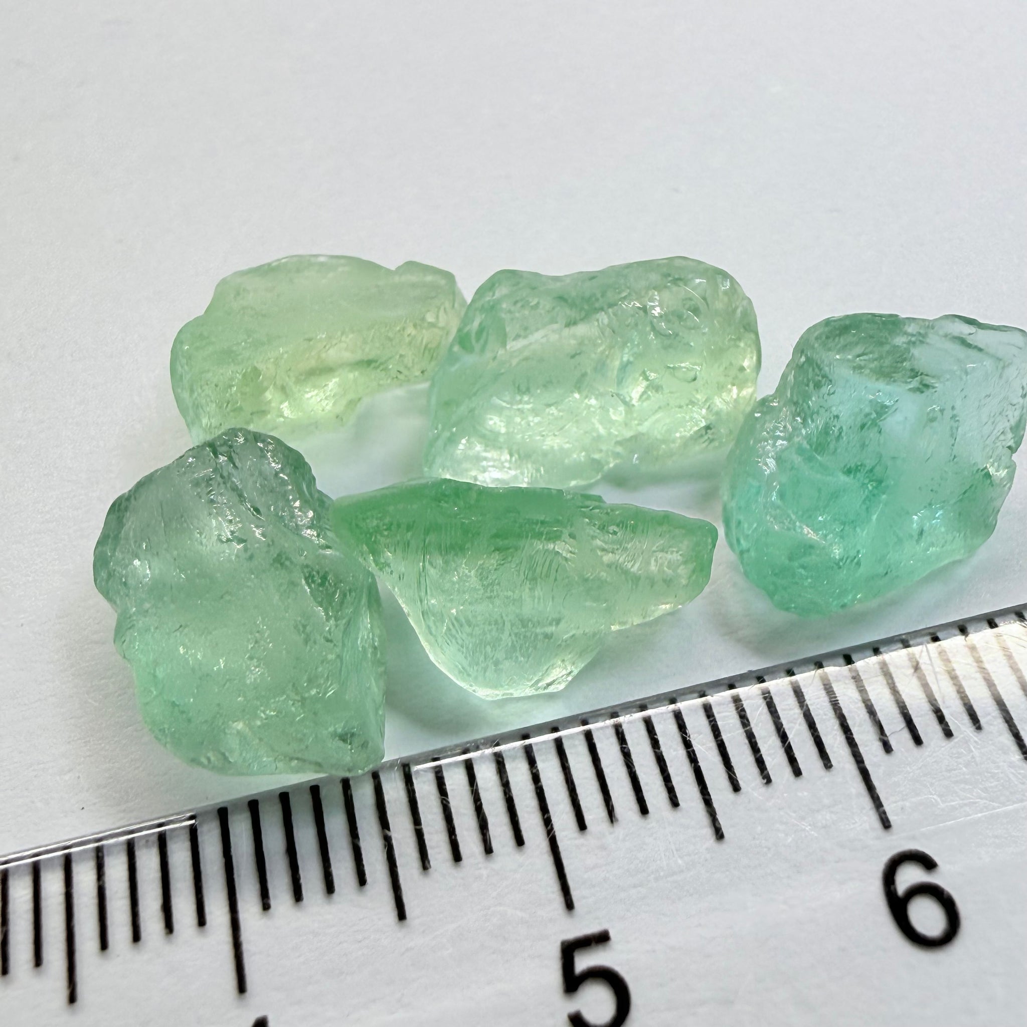 Aquamarine Lot, 22.31ct, Loliondo, Tanzania, Untreated Unheated, vs-vvs, one has a flat shape