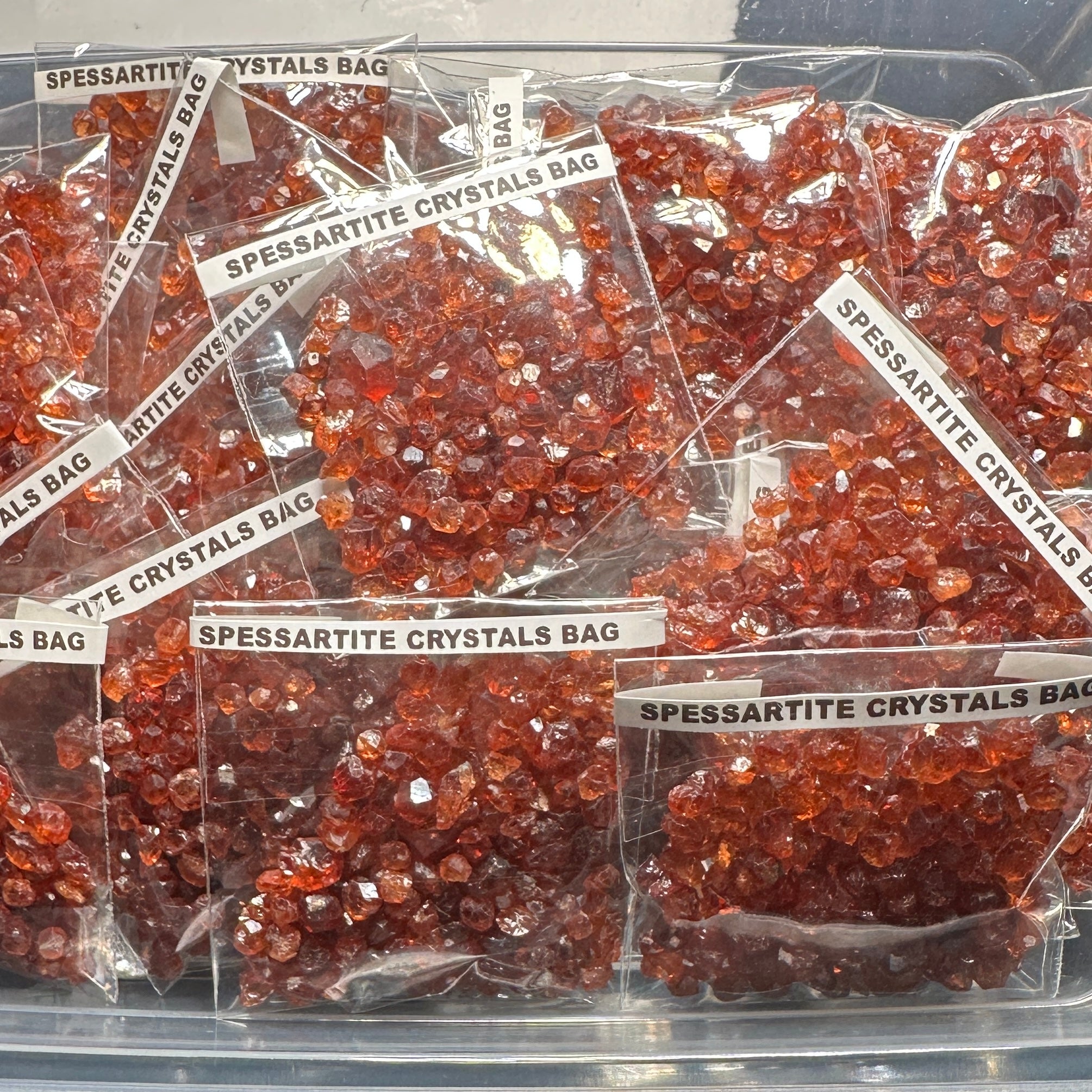 Spessartite Crystals Bag, Tanzania- for inlay only, not for faceting