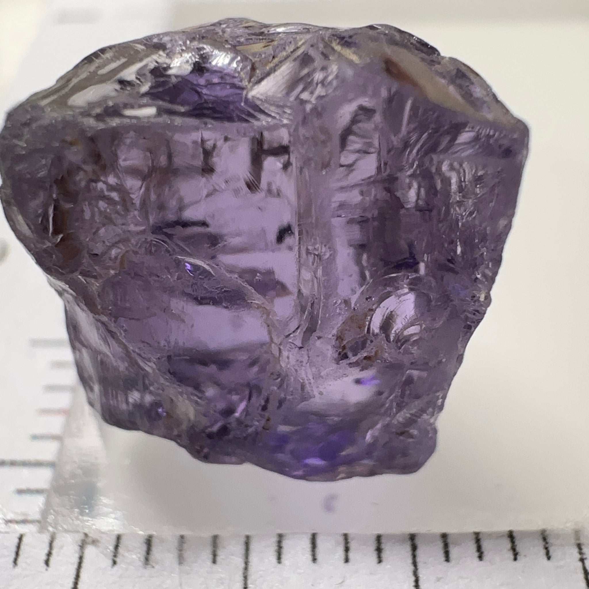 Purple Scapolite Crystal, 12.14ct, Tanzania, Untreated Unheated. Has a dividing crack, will need to be sawed, one side will be vvs-if clean, the other will be the same but will need some inclusions on the outside removed.