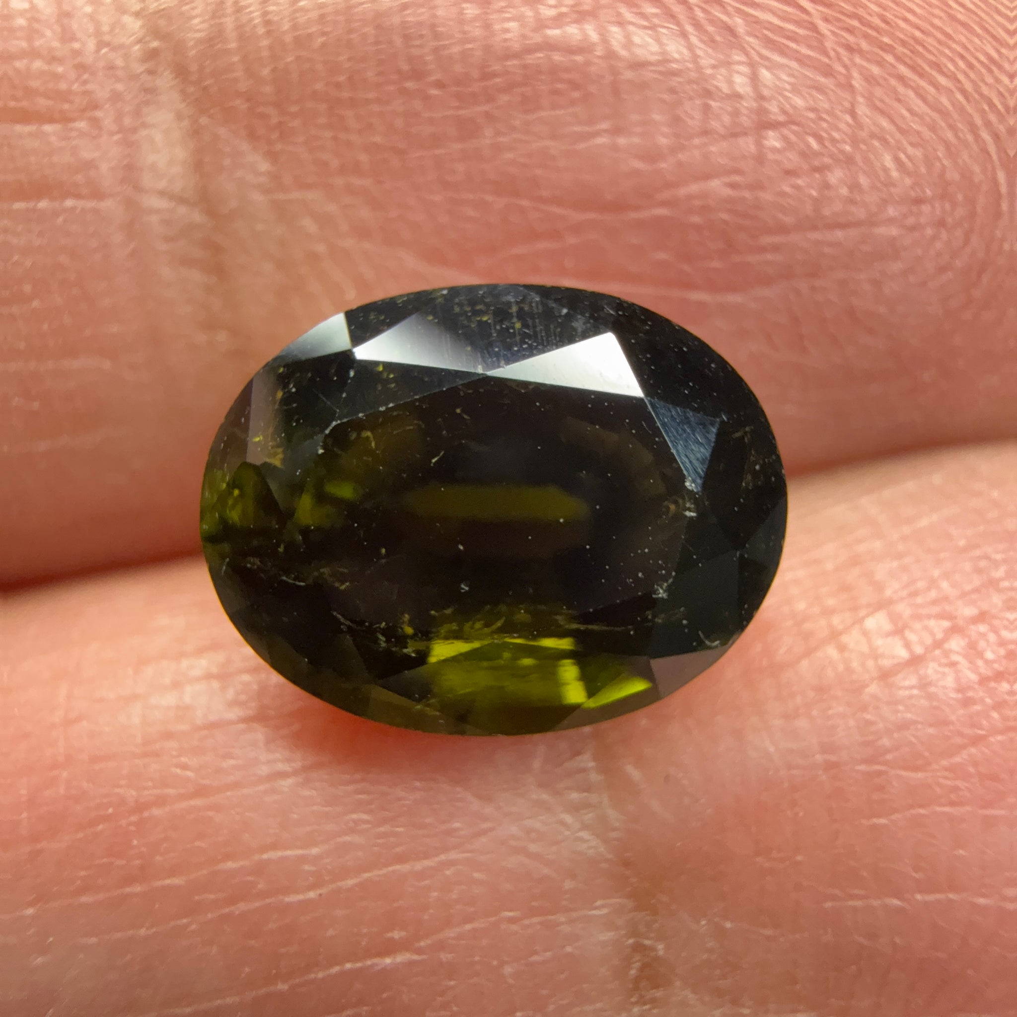 Chrome Tourmaline, 3.81ct, Tanzania, Untreated Unheated, native cut, a little too dark, see pictures, slight inclusions and slight scratches, but priced well if you can use it, photos in different lights as usual.