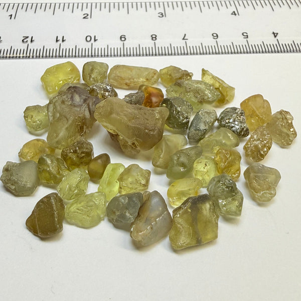 Chrysoberyl lot, 190.09ct, Tunduru, Tanzania, Untreated Unheated. A mix between faceting grade and cabbing grade rough, they change colour but only very very slightly, see video showing the different lights
