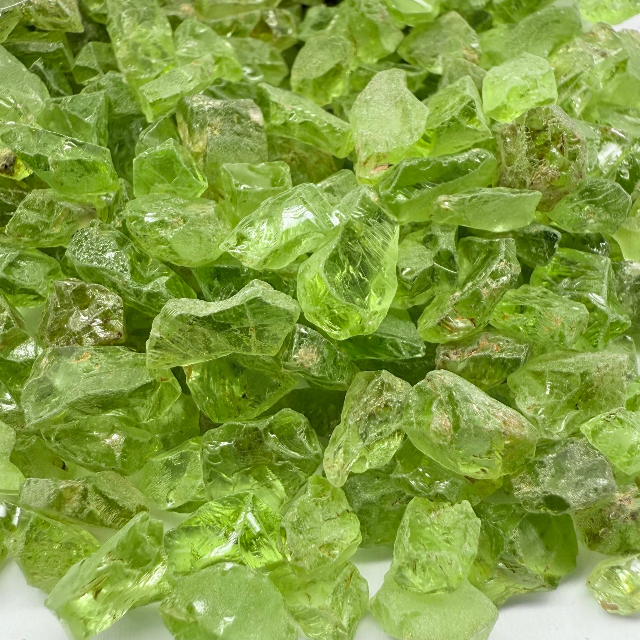 GoGo Peridot, Mined by the Wa GoGo tribe in Tanzania, Untreated Unheated, mixed clarity grades, FACETING ROUGH, SINGLES- price is per stone on a bind pour basis, av size is 1.89ct, excellent deal