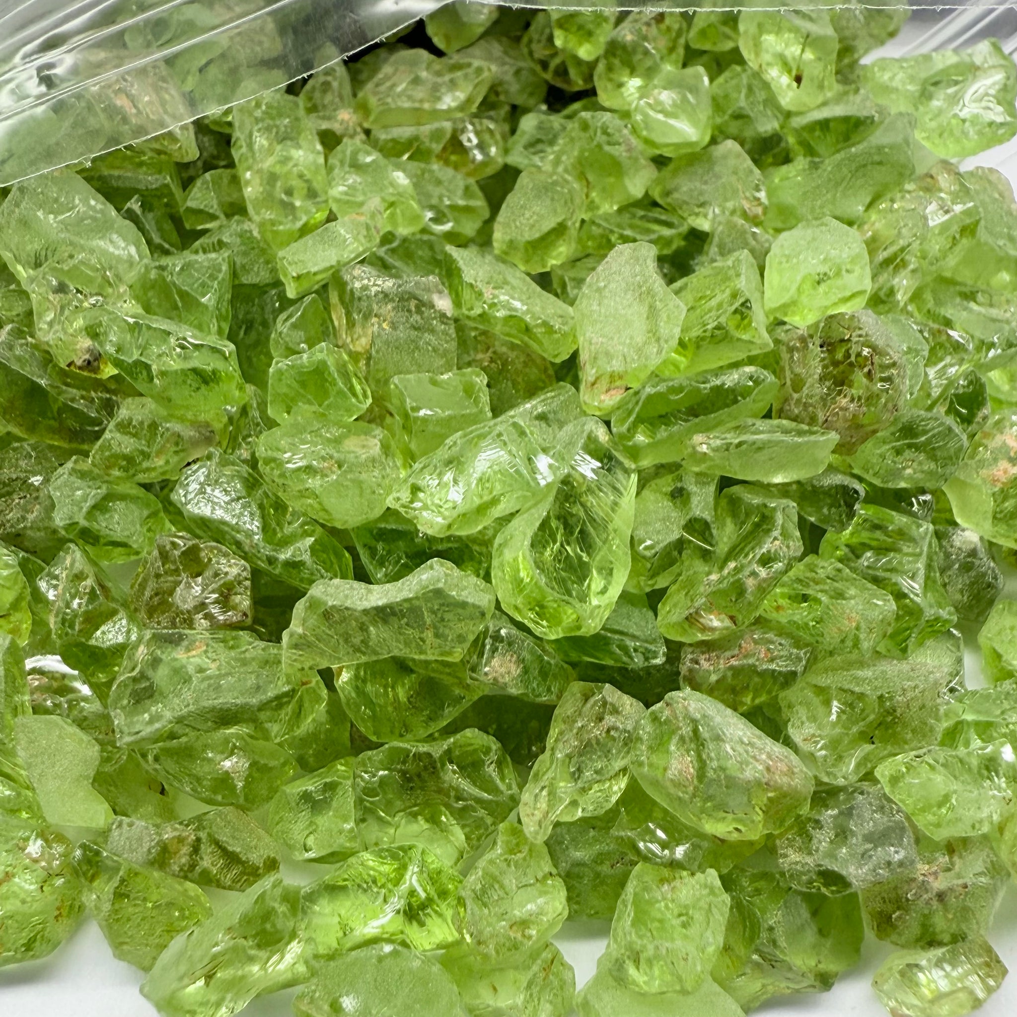 GoGo Peridot, Mined by the Wa GoGo tribe in Tanzania, Untreated Unheated, mixed clarity grades, FACETING ROUGH, SINGLES- price is per stone on a bind pour basis, av size is 1.89ct, excellent deal