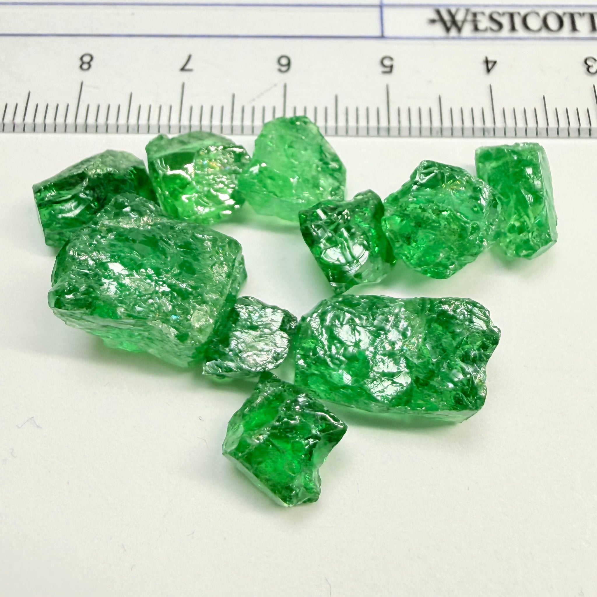 Tsavorite Lot, 61.75ct, Tanzania, Untreated, Unheated, this lot has veils and some pieces require some cobbing, if you know tsavorite you know what I’m talking about, many of the veiled, you can cut as is. See the videos for clarify magnification