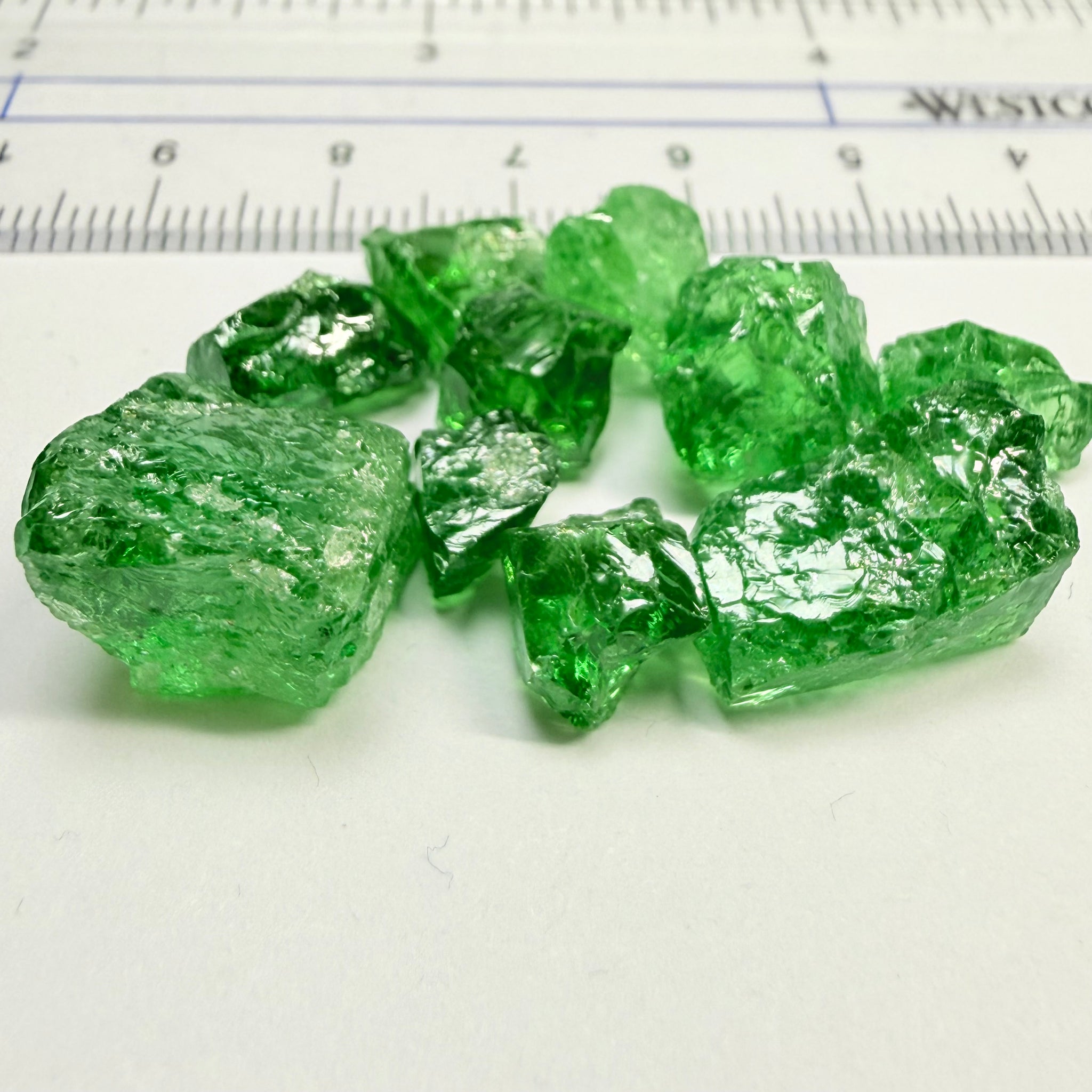 Tsavorite Lot, 61.75ct, Tanzania, Untreated, Unheated, this lot has veils and some pieces require some cobbing, if you know tsavorite you know what I’m talking about, many of the veiled, you can cut as is. See the videos for clarify magnification