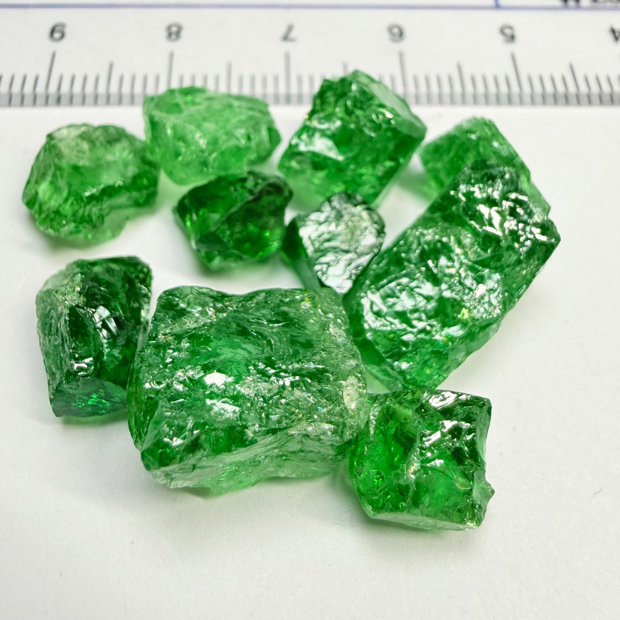 Tsavorite Lot, 61.75ct, Tanzania, Untreated, Unheated, this lot has veils and some pieces require some cobbing, if you know tsavorite you know what I’m talking about, many of the veiled, you can cut as is. See the videos for clarify magnification