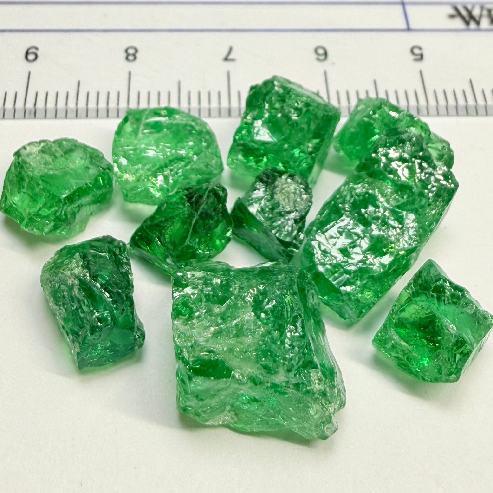 Tsavorite Lot, 61.75ct, Tanzania, Untreated, Unheated, this lot has veils and some pieces require some cobbing, if you know tsavorite you know what I’m talking about, many of the veiled, you can cut as is. See the videos for clarify magnification