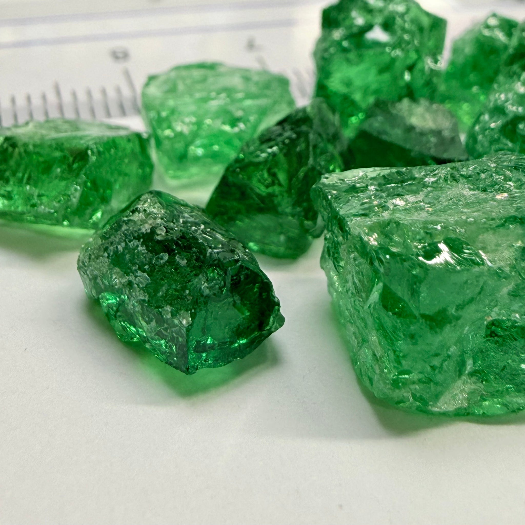 Tsavorite Lot, 61.75ct, Tanzania, Untreated, Unheated, this lot has veils and some pieces require some cobbing, if you know tsavorite you know what I’m talking about, many of the veiled, you can cut as is. See the videos for clarify magnification
