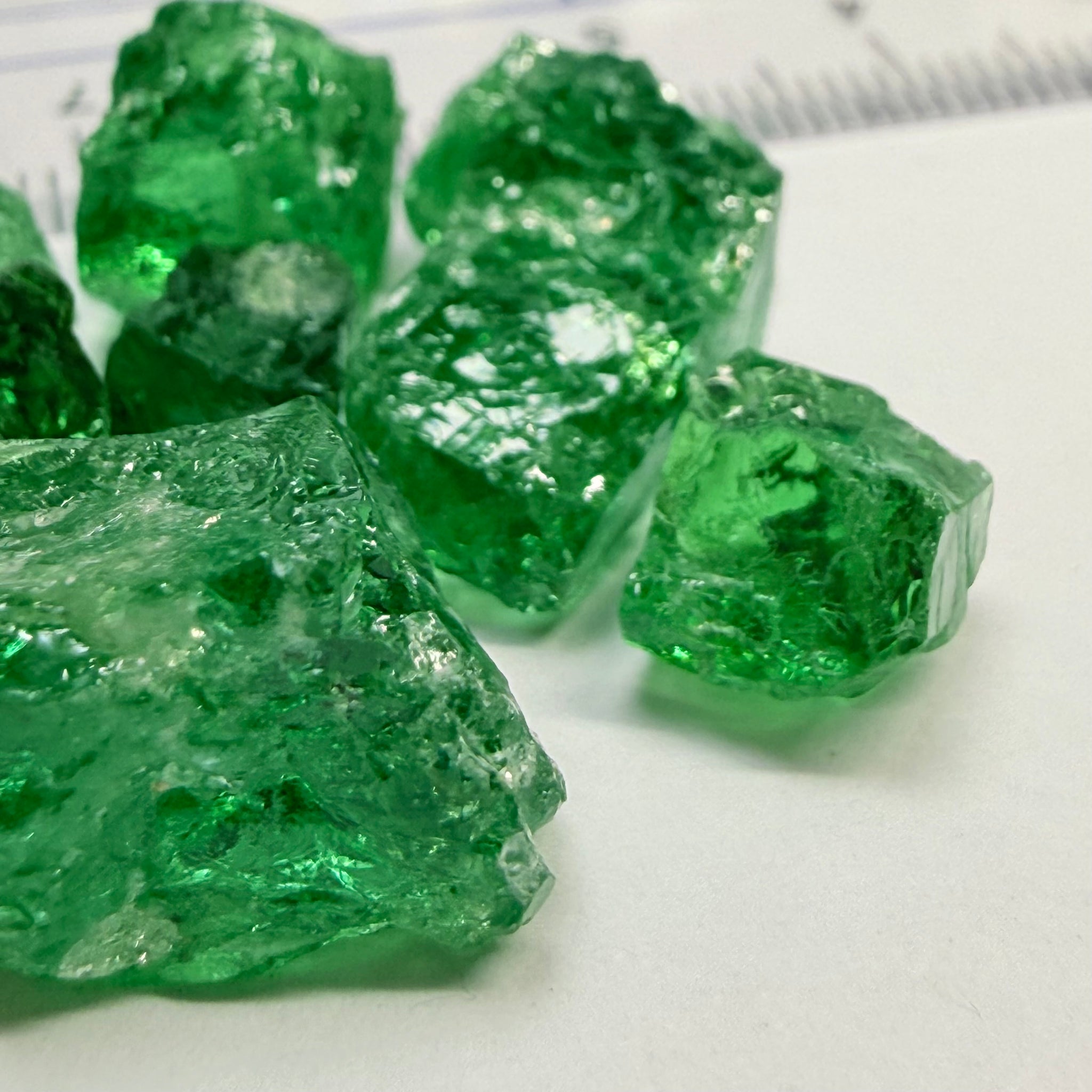 Tsavorite Lot, 61.75ct, Tanzania, Untreated, Unheated, this lot has veils and some pieces require some cobbing, if you know tsavorite you know what I’m talking about, many of the veiled, you can cut as is. See the videos for clarify magnification