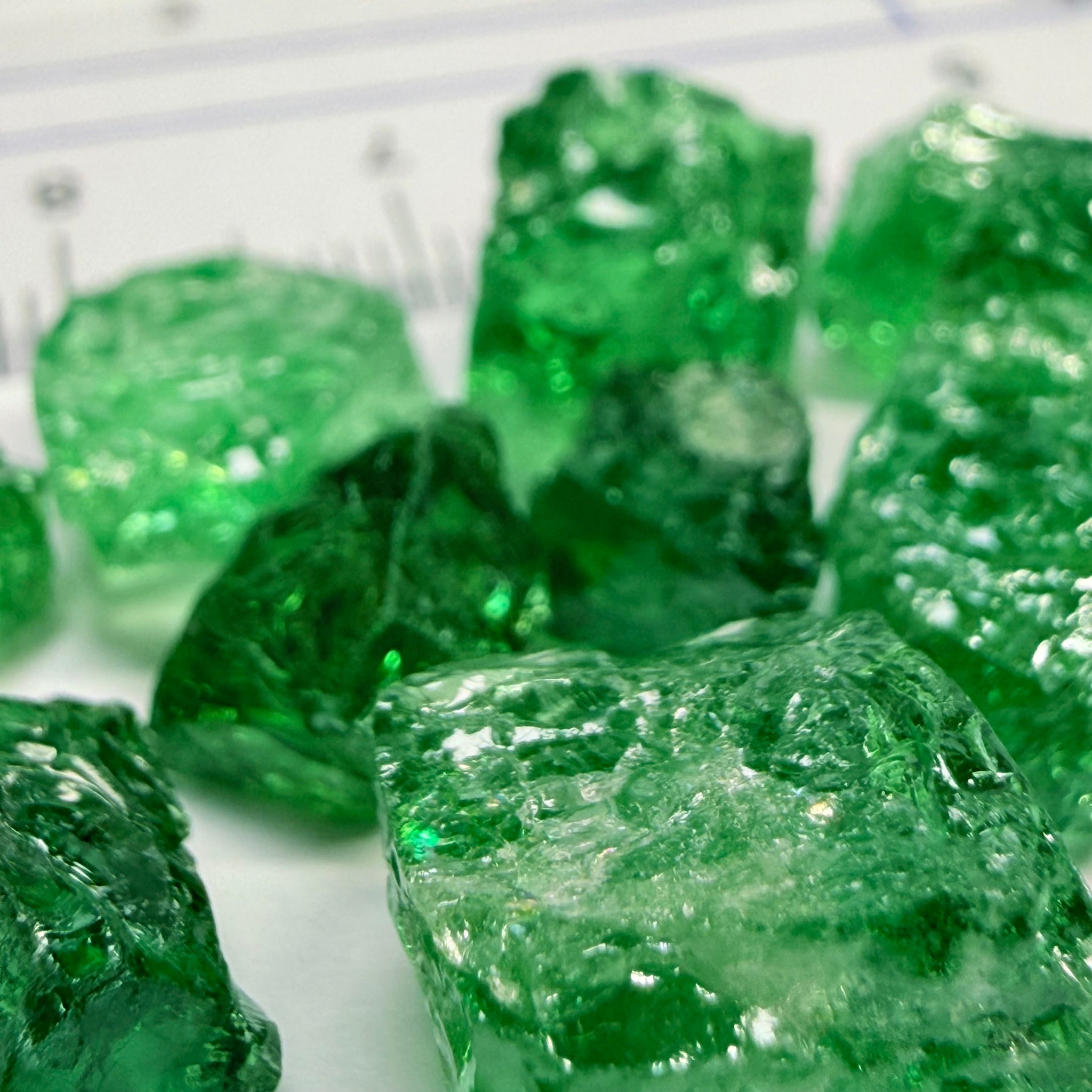 Tsavorite Lot, 61.75ct, Tanzania, Untreated, Unheated, this lot has veils and some pieces require some cobbing, if you know tsavorite you know what I’m talking about, many of the veiled, you can cut as is. See the videos for clarify magnification