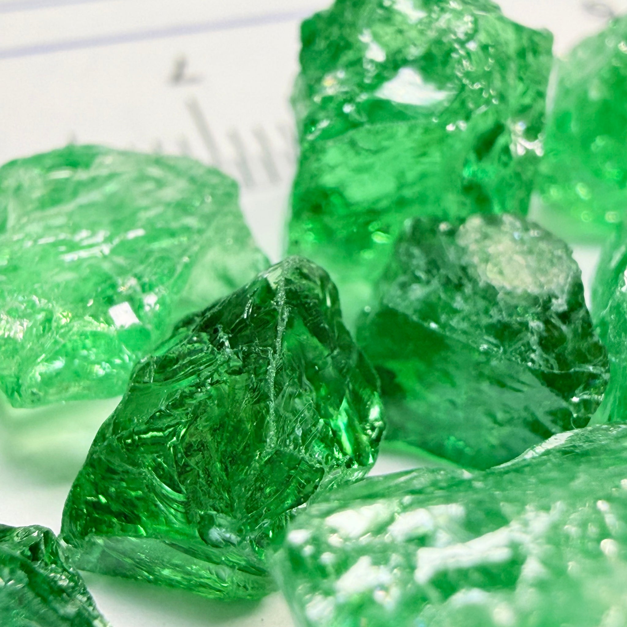 Tsavorite Lot, 61.75ct, Tanzania, Untreated, Unheated, this lot has veils and some pieces require some cobbing, if you know tsavorite you know what I’m talking about, many of the veiled, you can cut as is. See the videos for clarify magnification