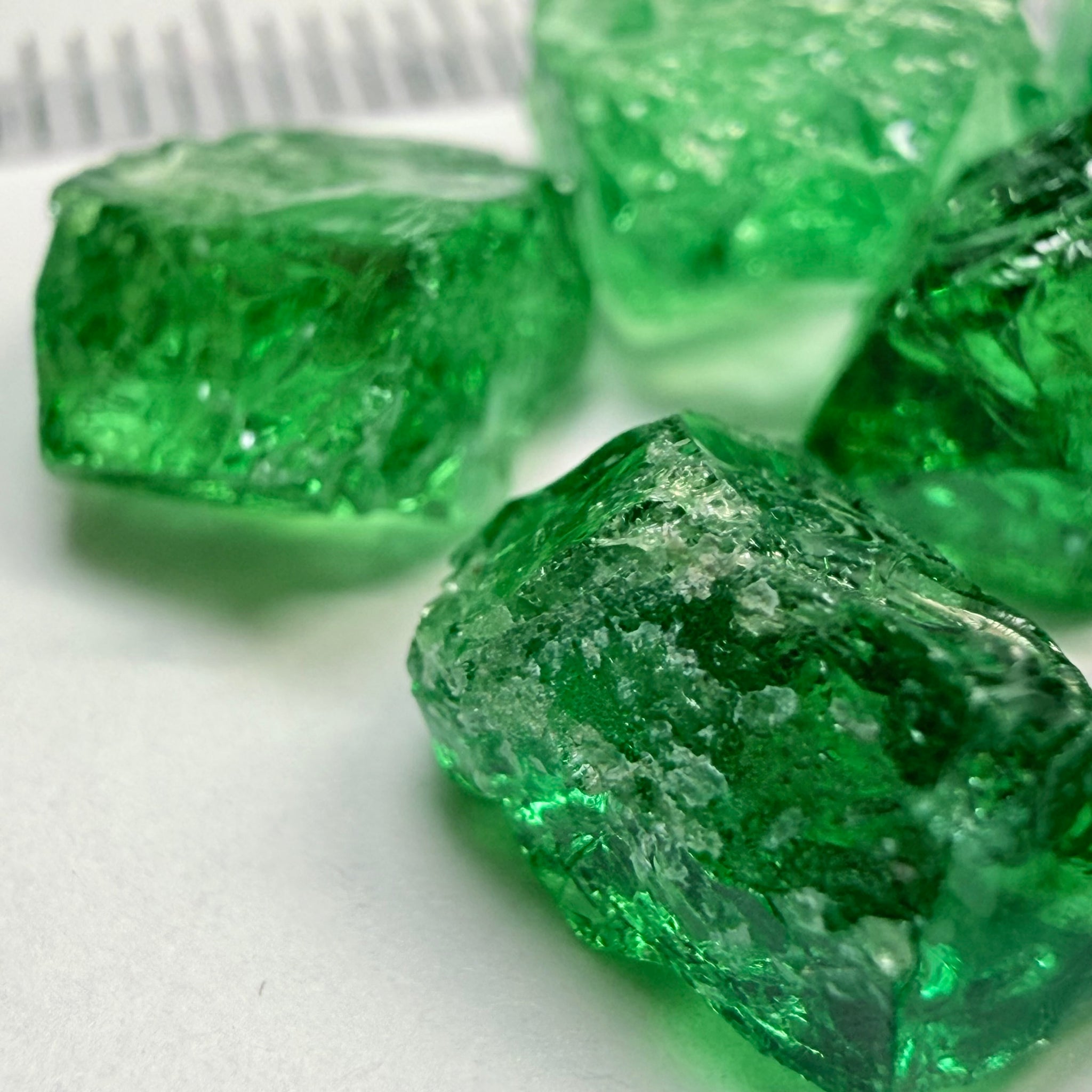 Tsavorite Lot, 61.75ct, Tanzania, Untreated, Unheated, this lot has veils and some pieces require some cobbing, if you know tsavorite you know what I’m talking about, many of the veiled, you can cut as is. See the videos for clarify magnification