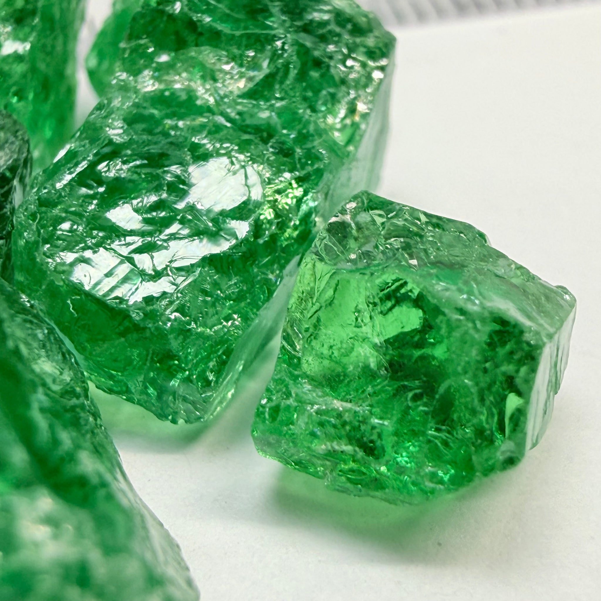 Tsavorite Lot, 61.75ct, Tanzania, Untreated, Unheated, this lot has veils and some pieces require some cobbing, if you know tsavorite you know what I’m talking about, many of the veiled, you can cut as is. See the videos for clarify magnification