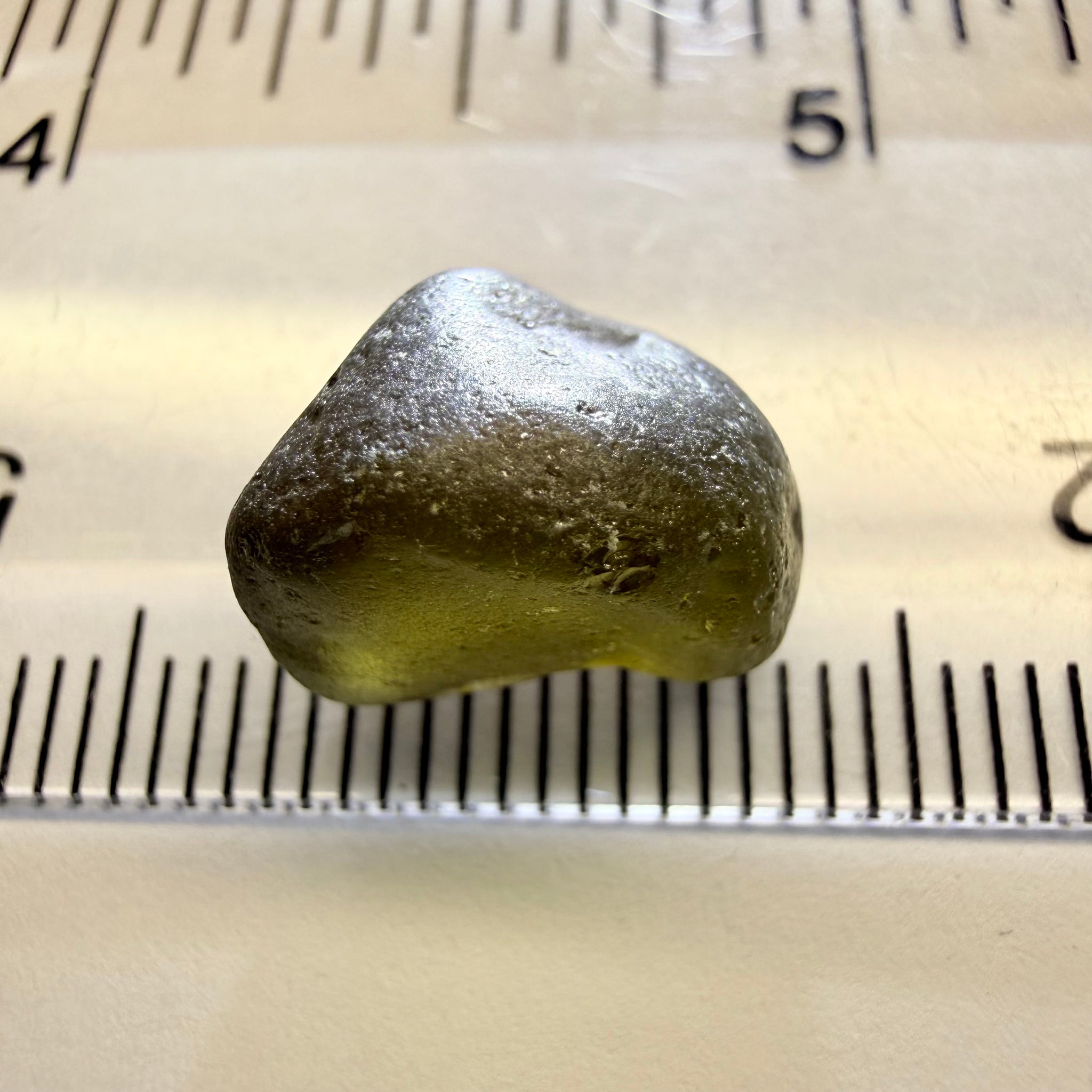 Green Brown Zircon, 12.07ct, Tunduru, Tanzania, Untreated Unheated, vvs-if with the characteristic haze in them found in green zircons from that location